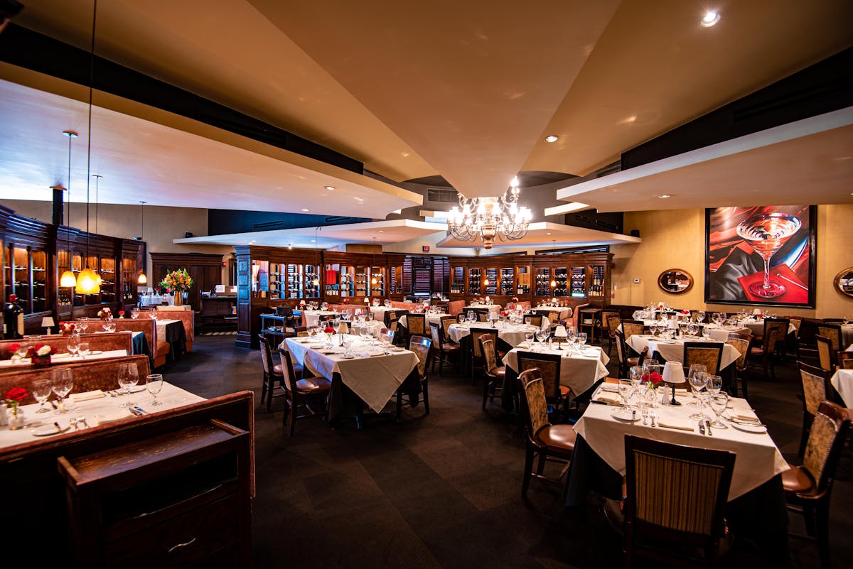 a group of people sitting at a table in a room