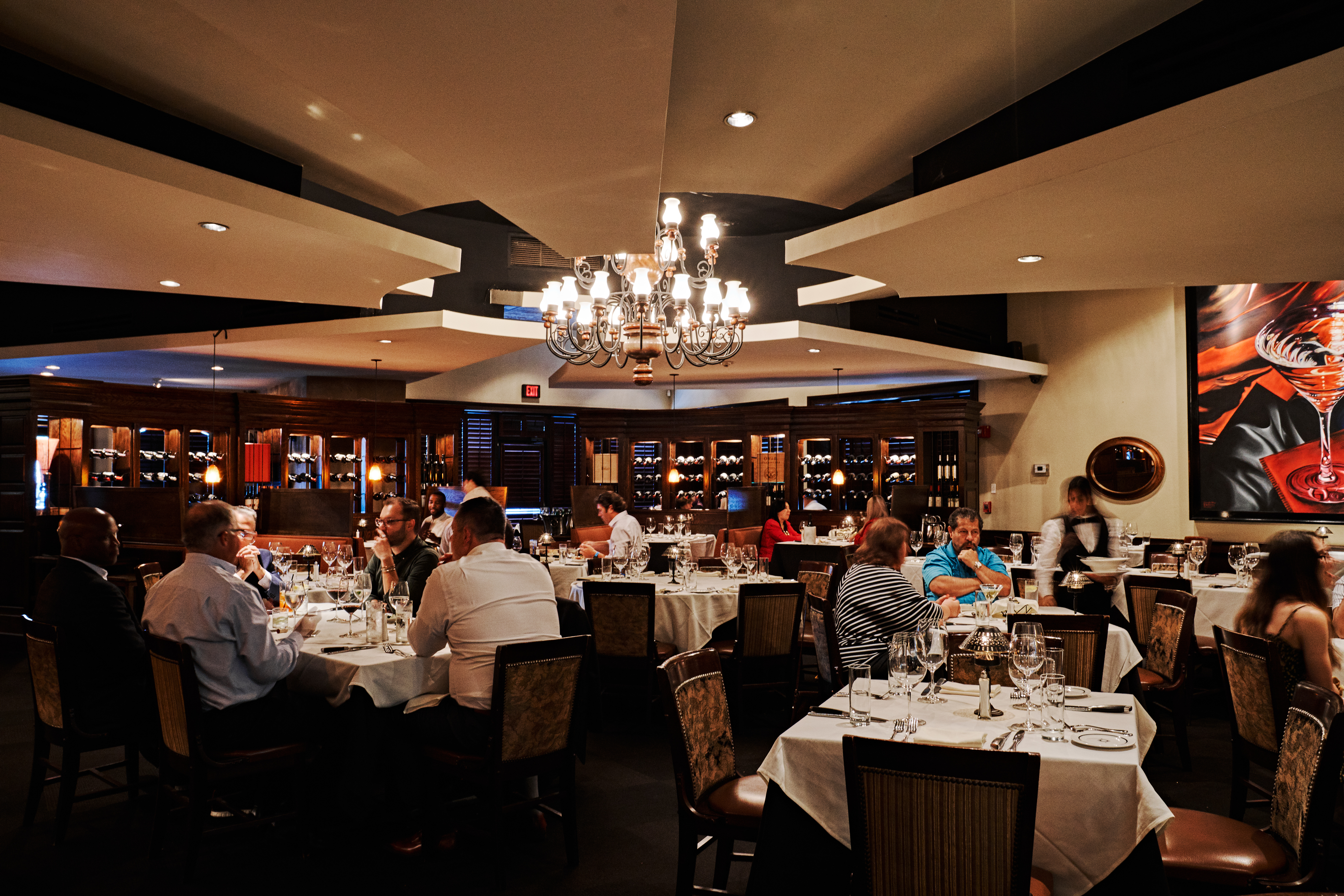 a group of people sitting at a table in a restaurant