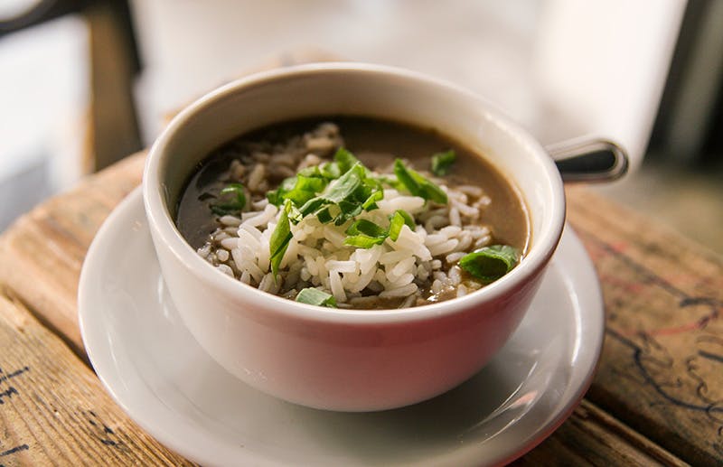 a bowl of soup sitting on a table