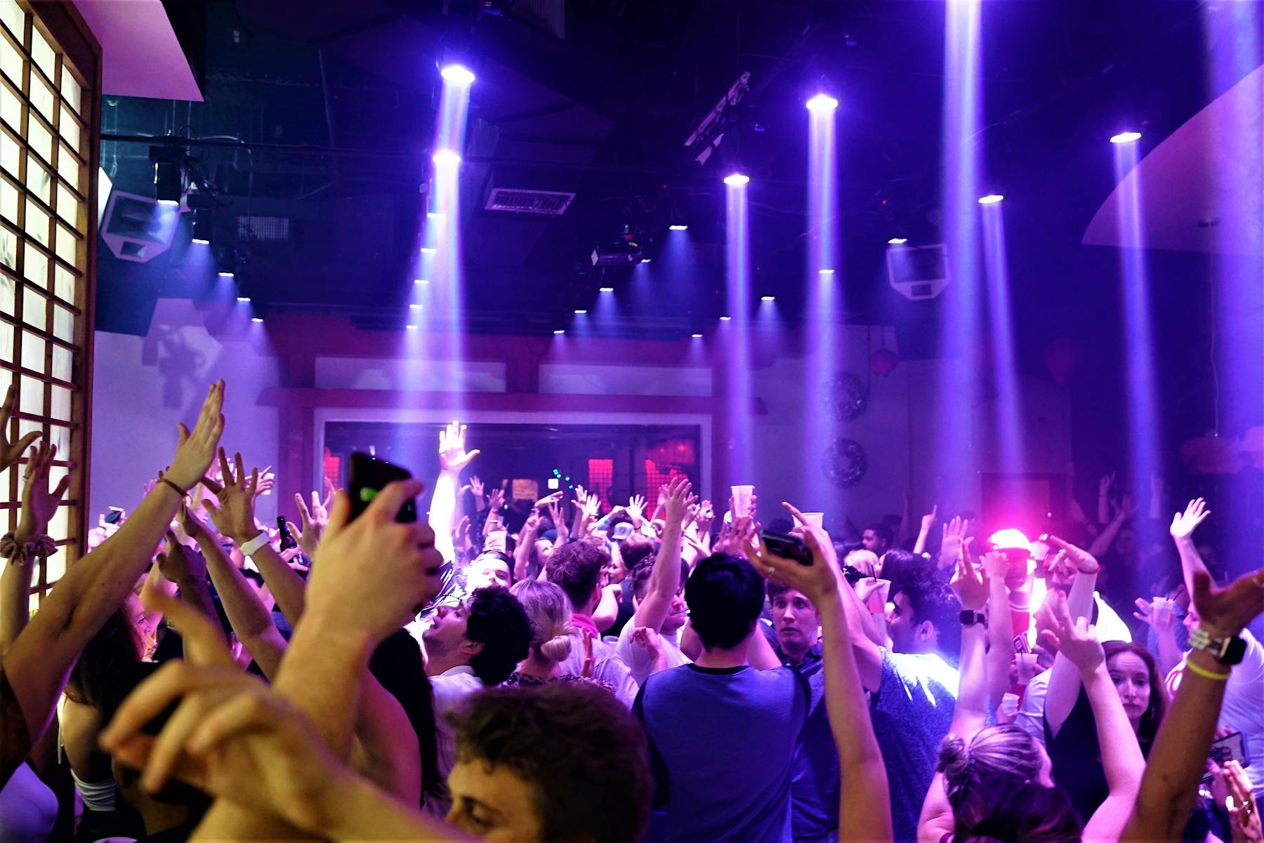 a group of people on a stage in front of a crowd