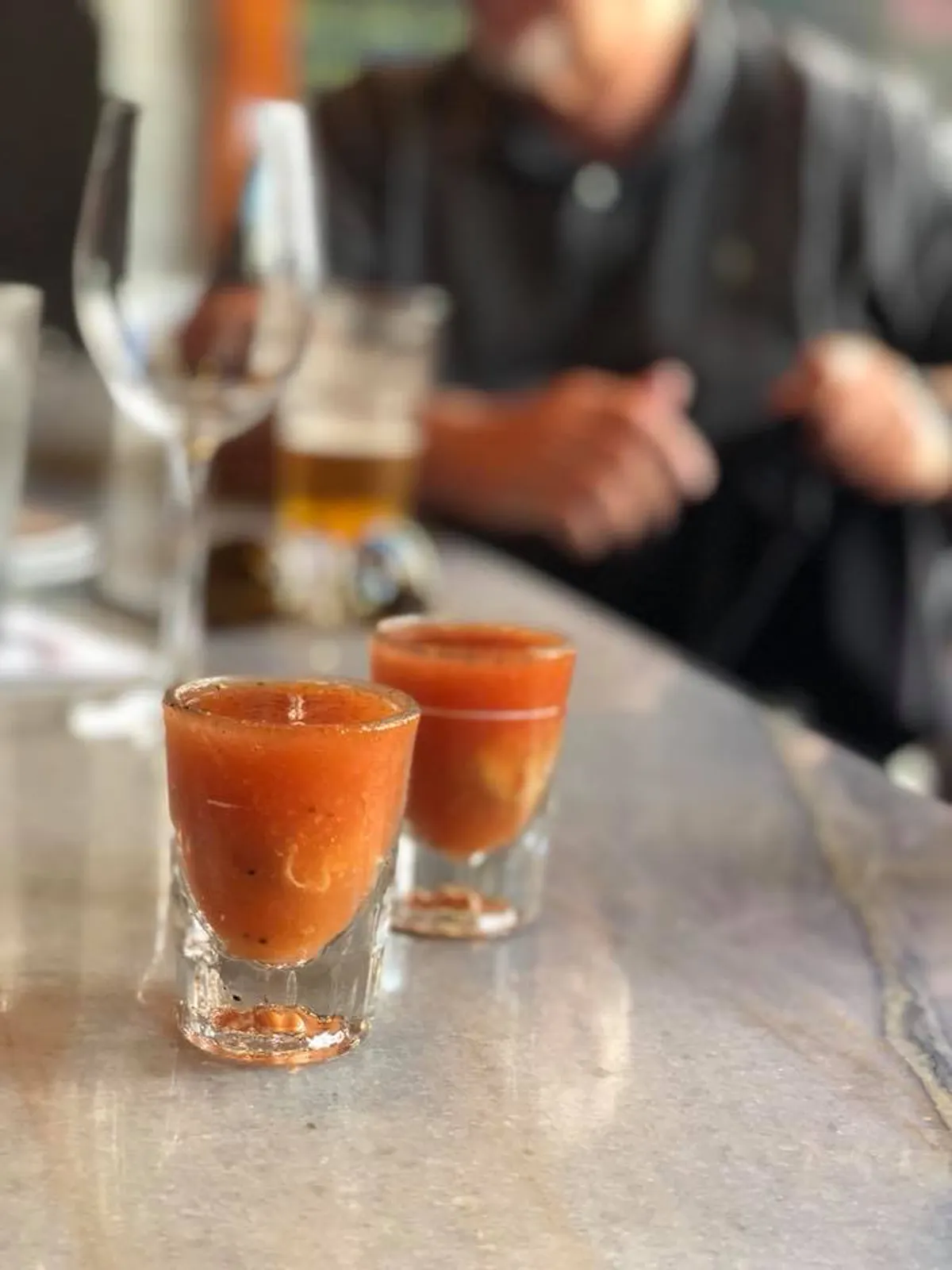 a glass of orange juice on a table