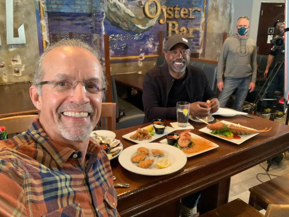 Kyle Petty sitting at a table with food