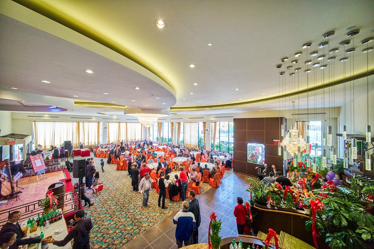 a crowd of people standing in a room