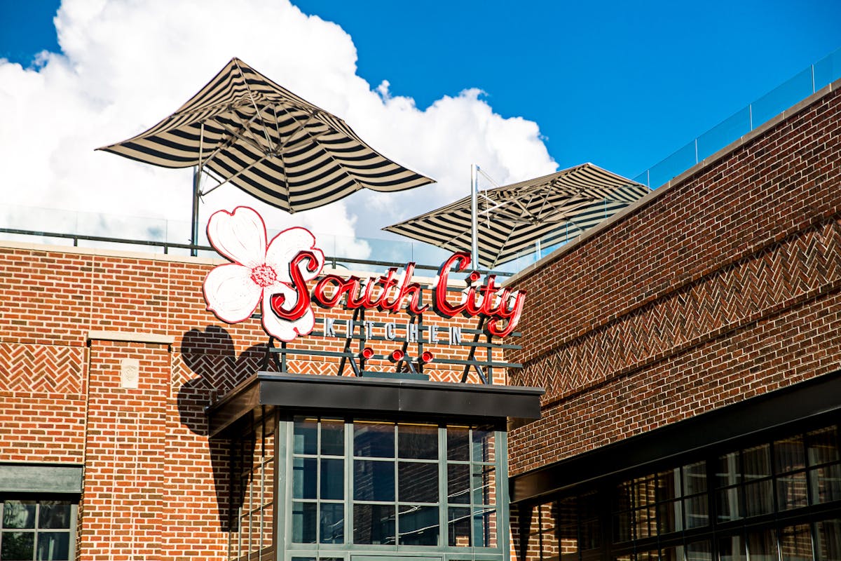 a sign in front of a building