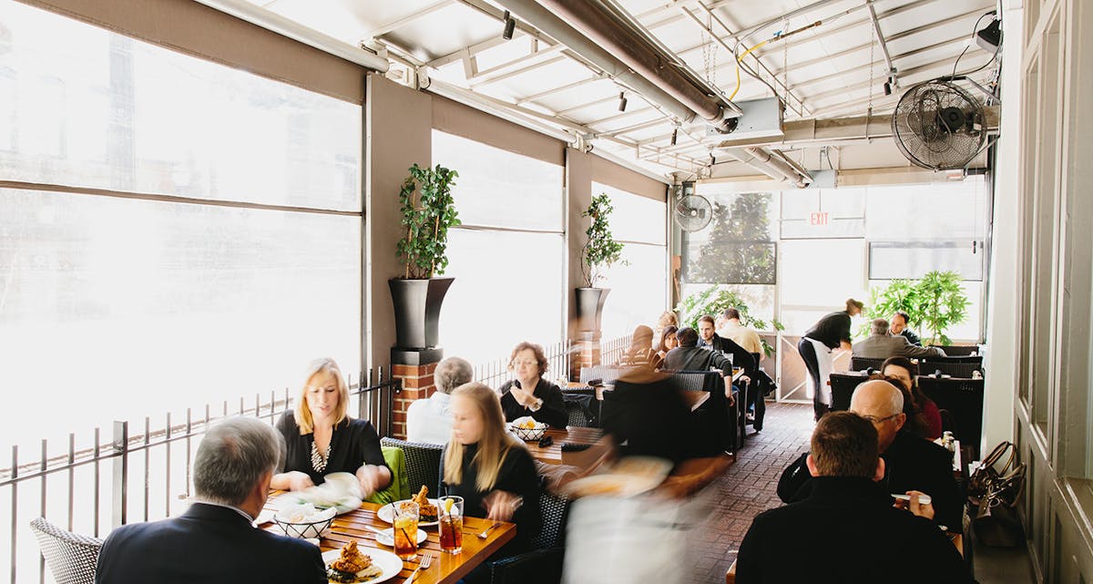 a group of people sitting at a table