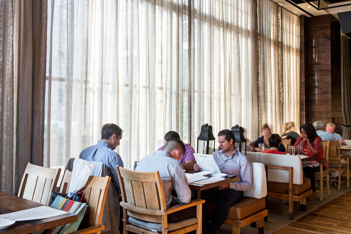 a group of people sitting at a table