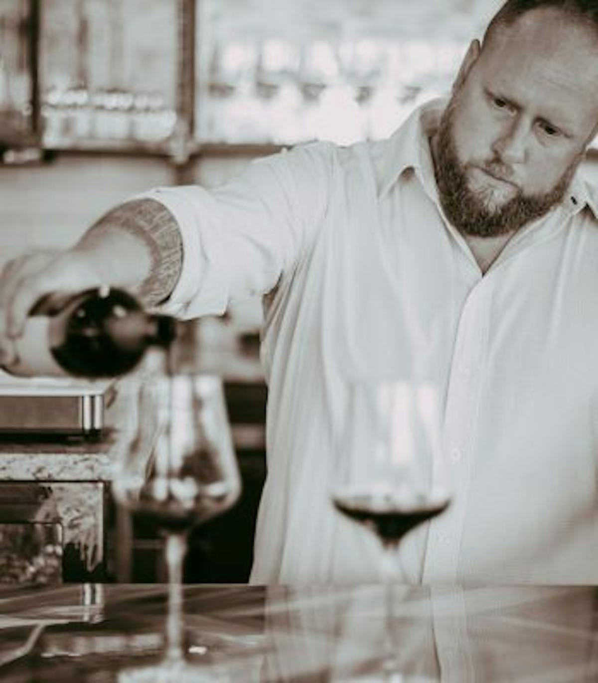 a person holding a glass of wine