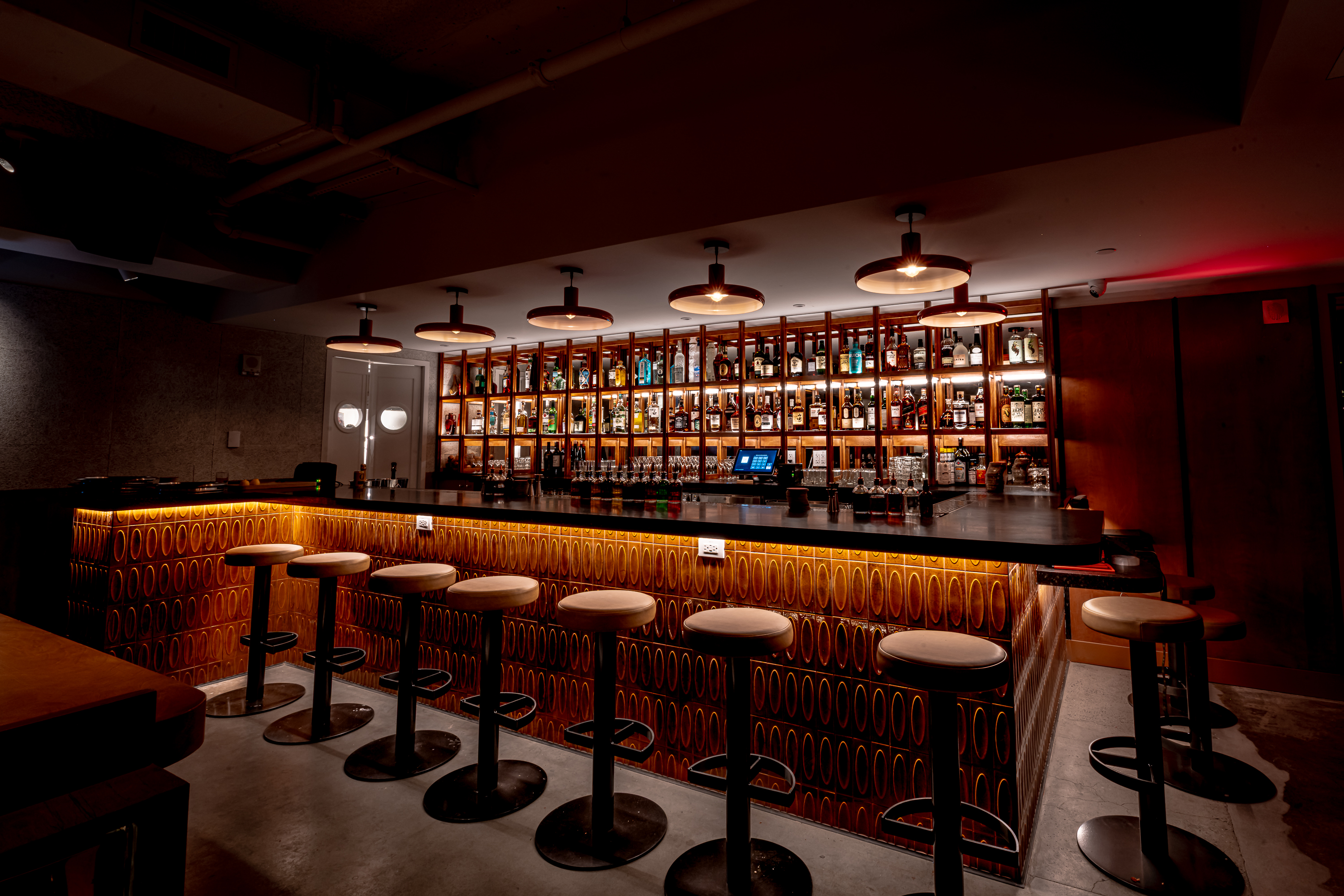 a group of people sitting at a table in a restaurant