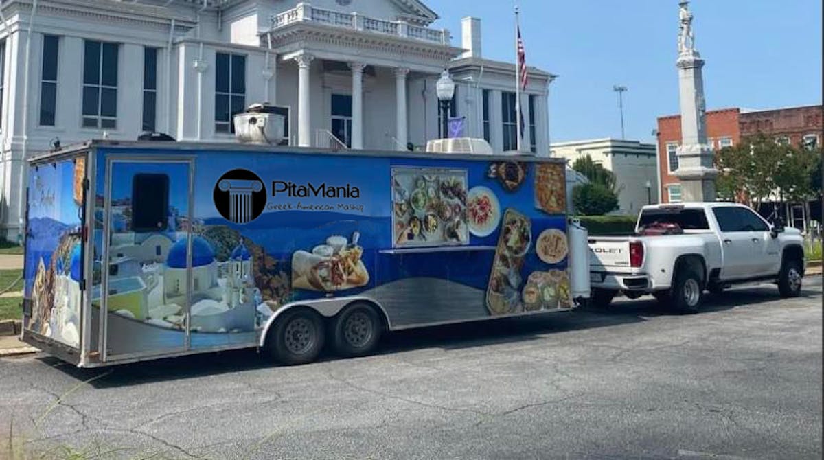 a truck is parked on the side of a building