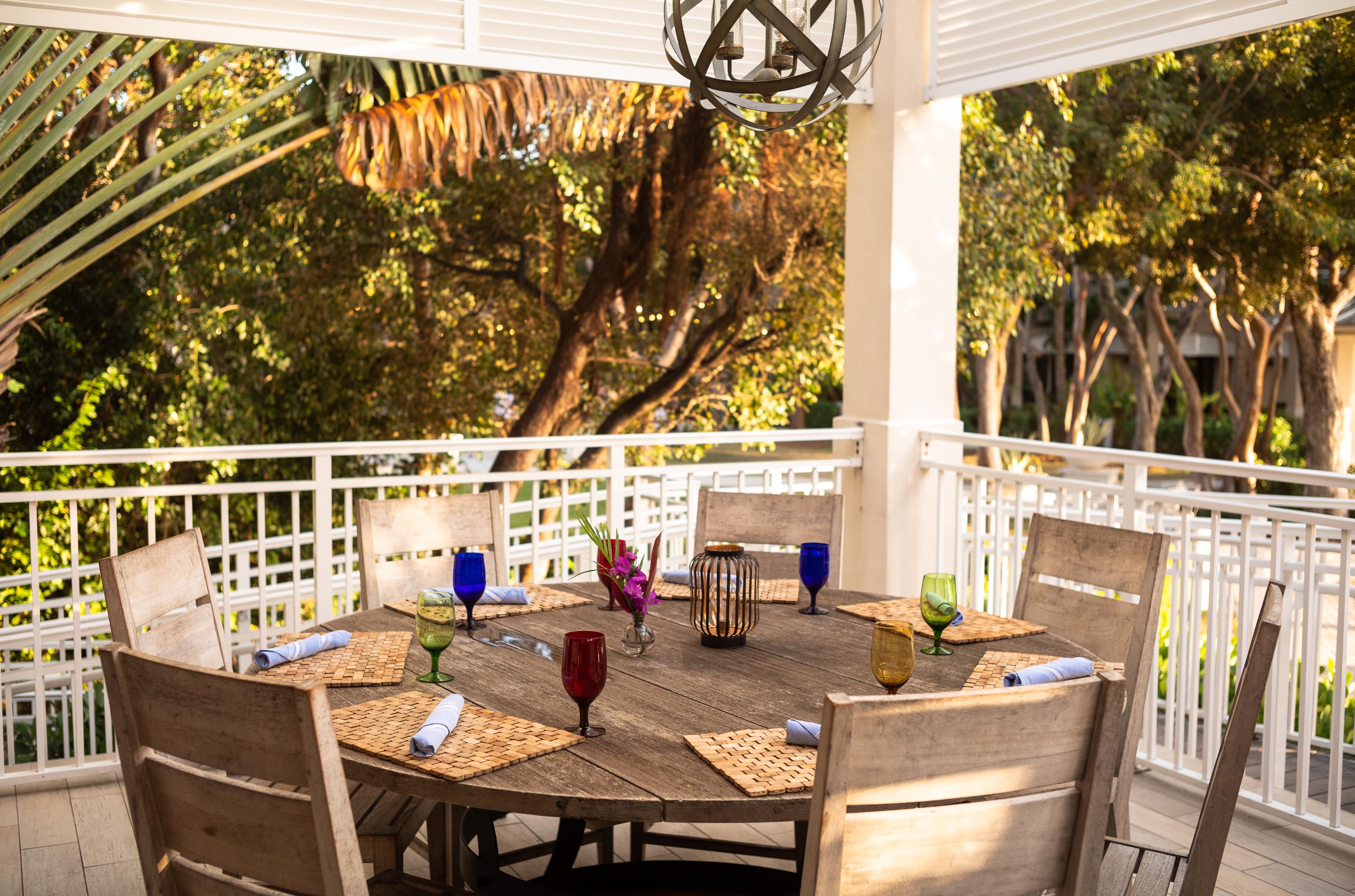a dining room table in front of a fence