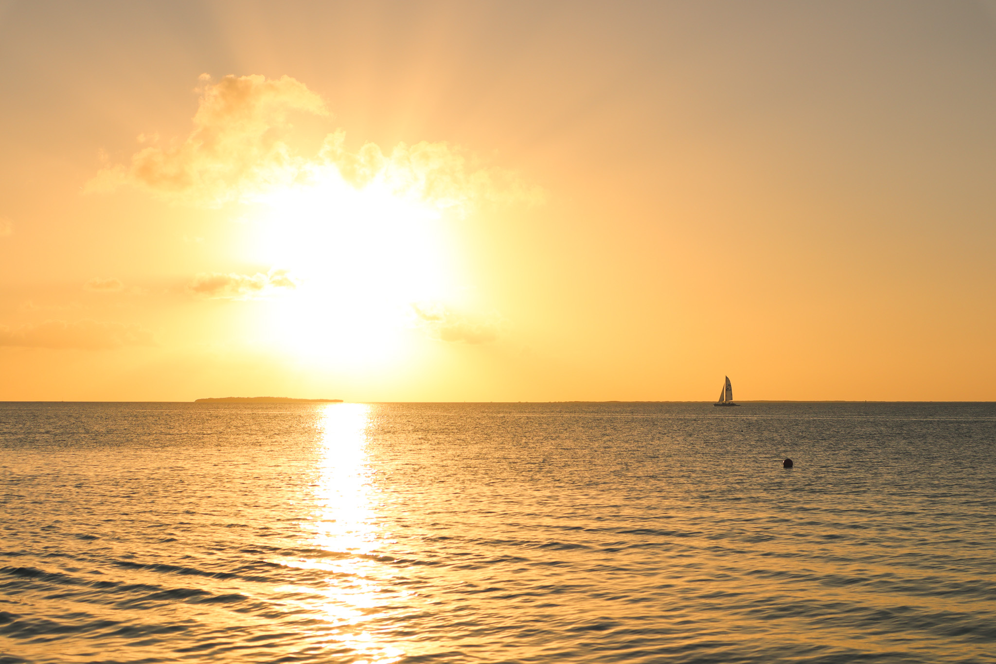 a sunset over a body of water