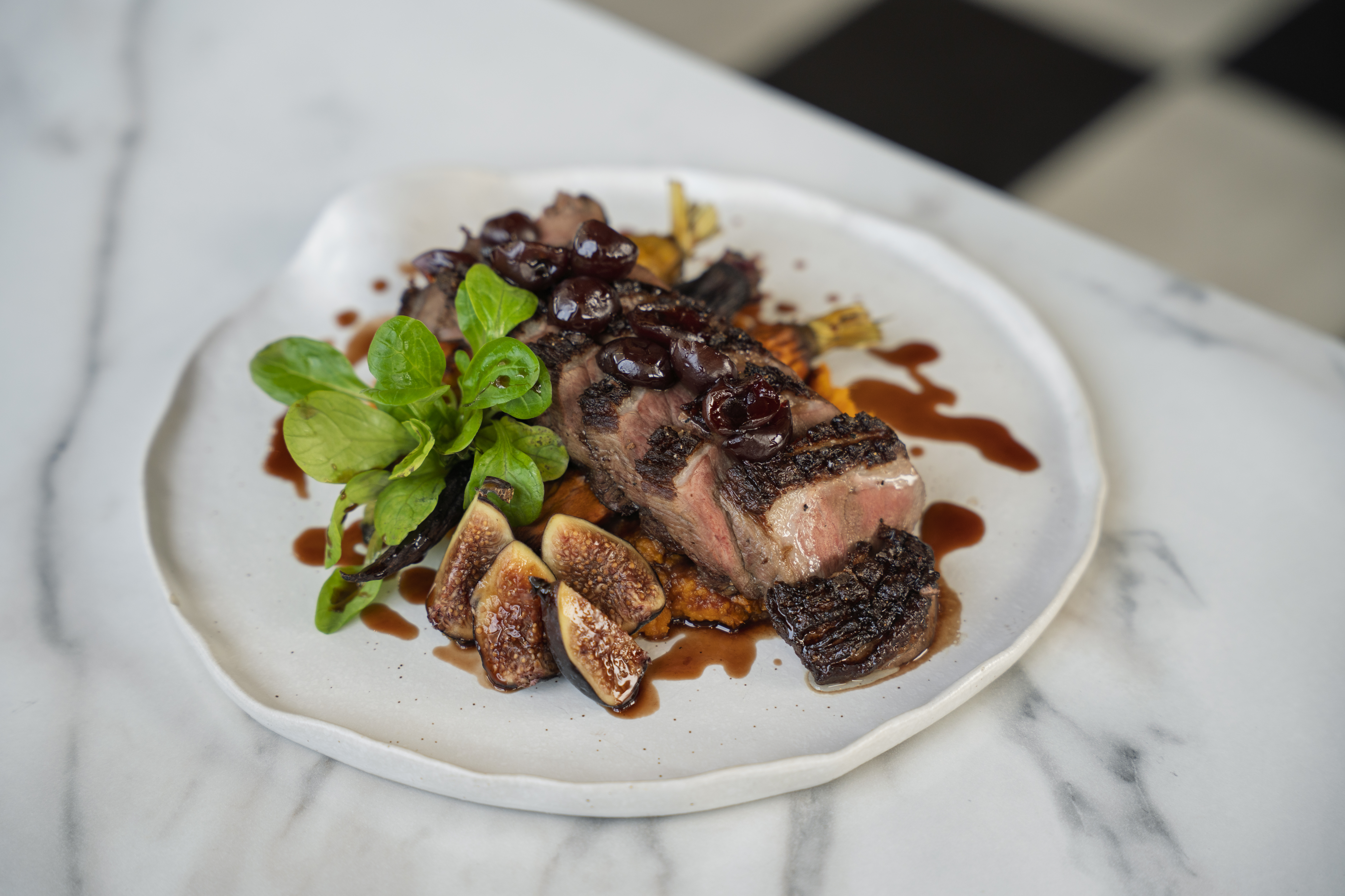 Pan-Roasted Duck Breast with fig glaze, sweet potato purée, and heirloom carrots