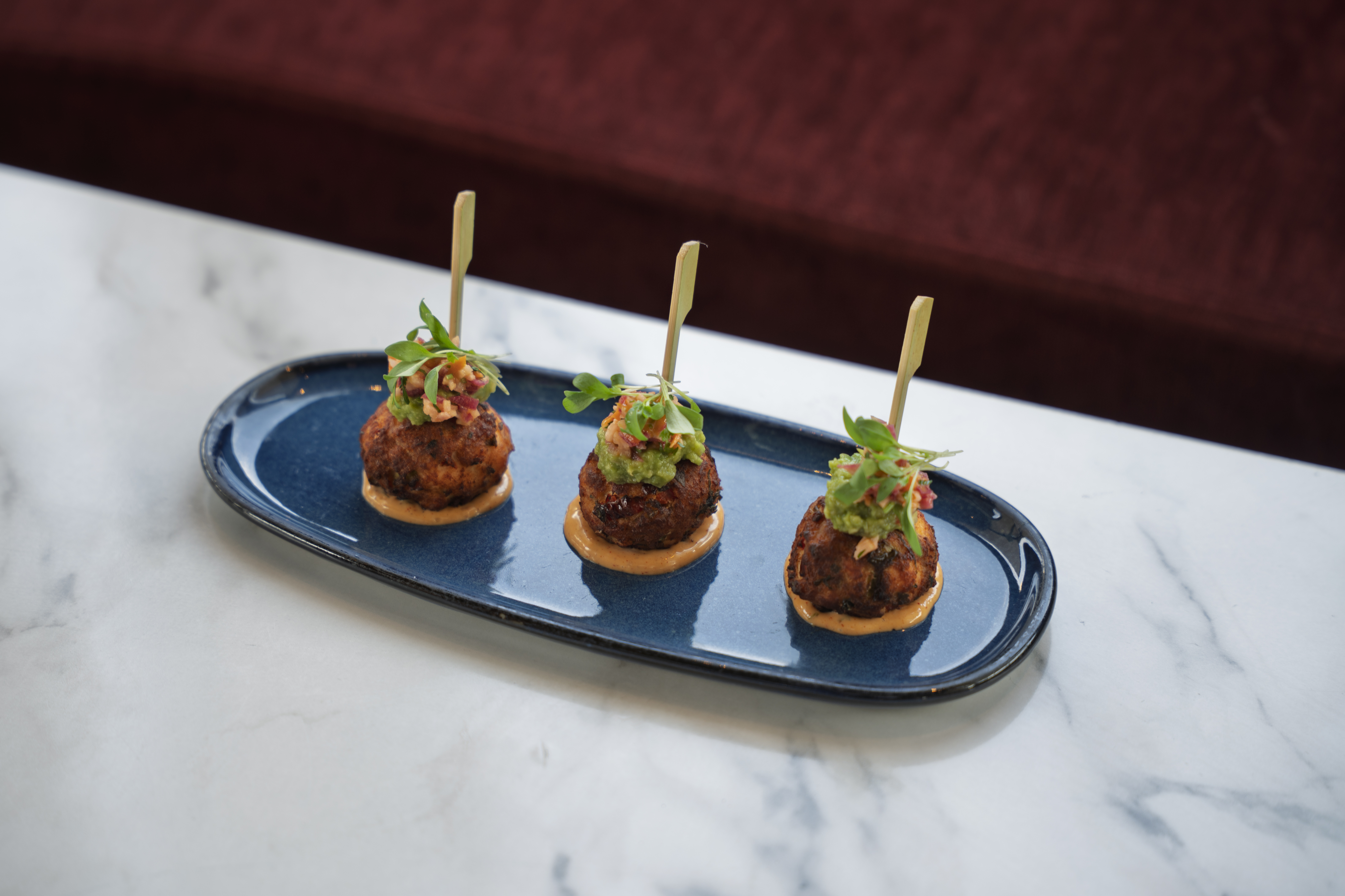 Salmon Croquettes with togarashi aioli and pickled root vegetables