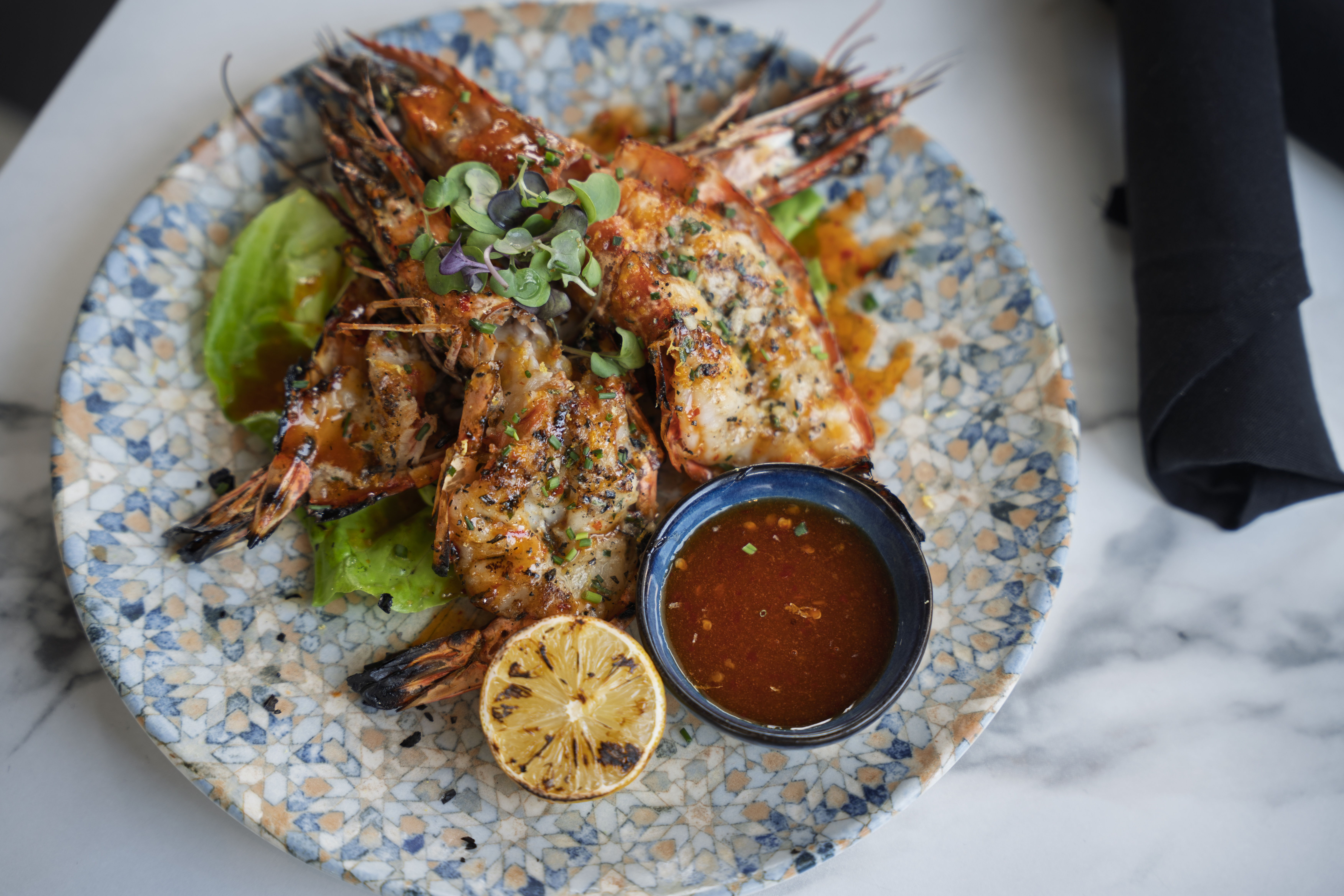 Grilled shell-on jumbo prawns glazed with sweet chili