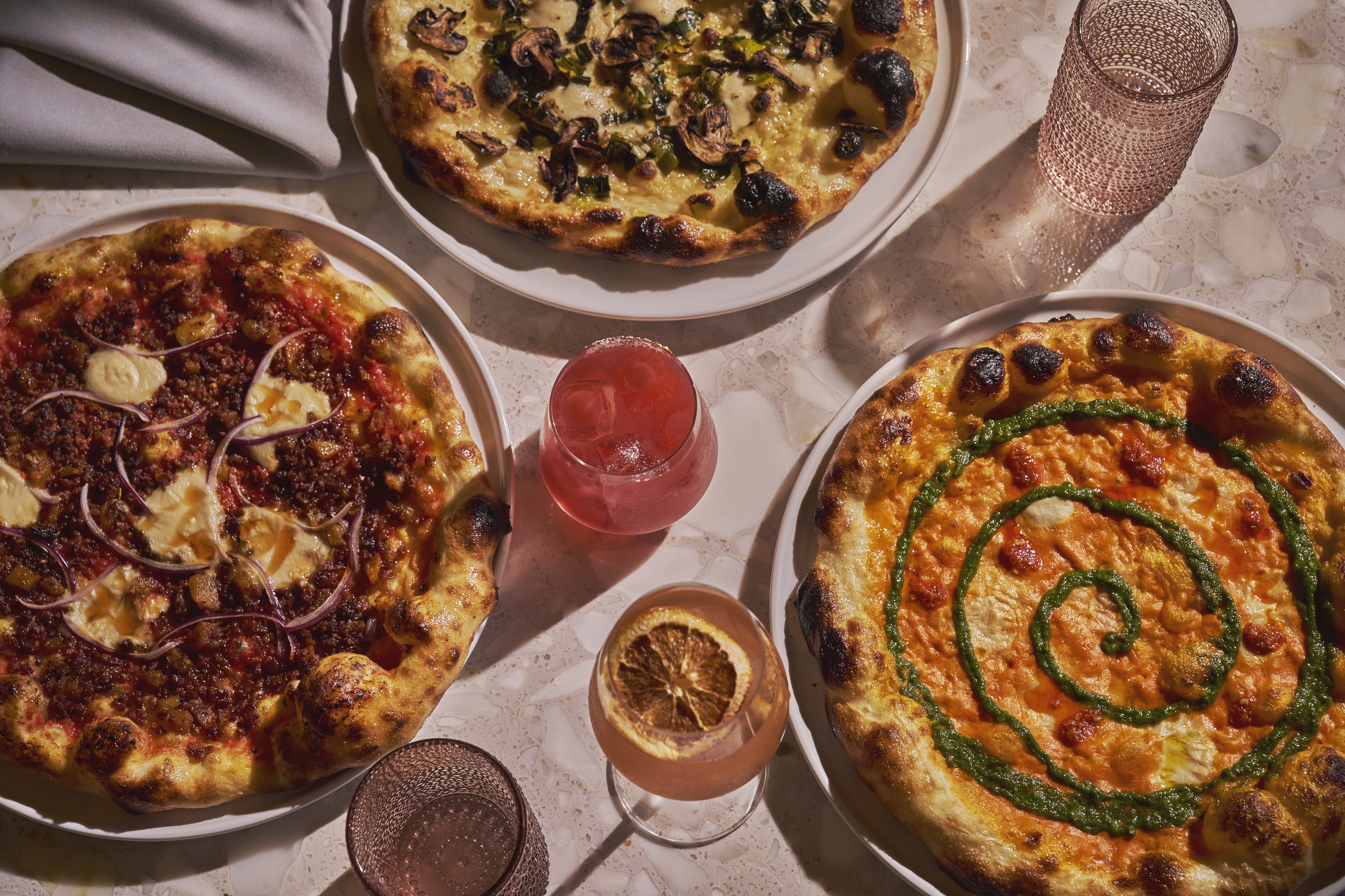 a pizza sitting on top of a plate of food