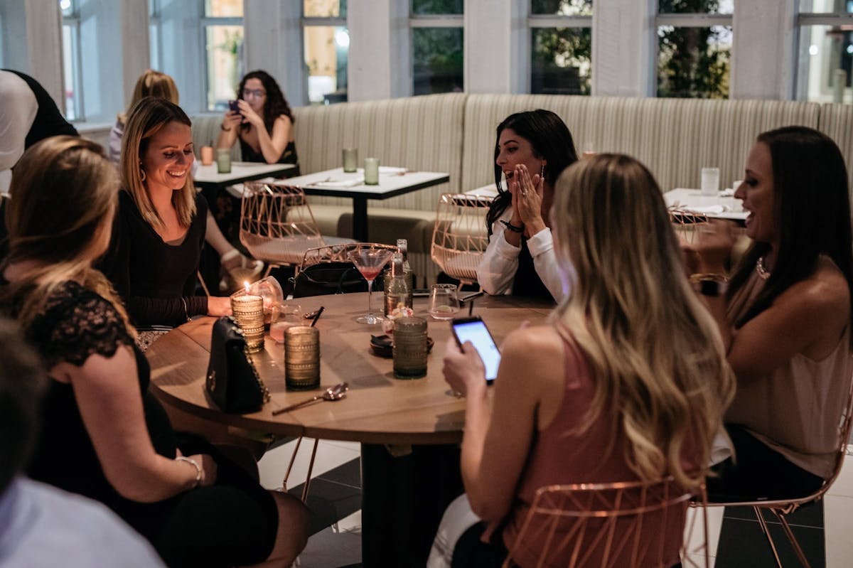 a group of people sitting at a table