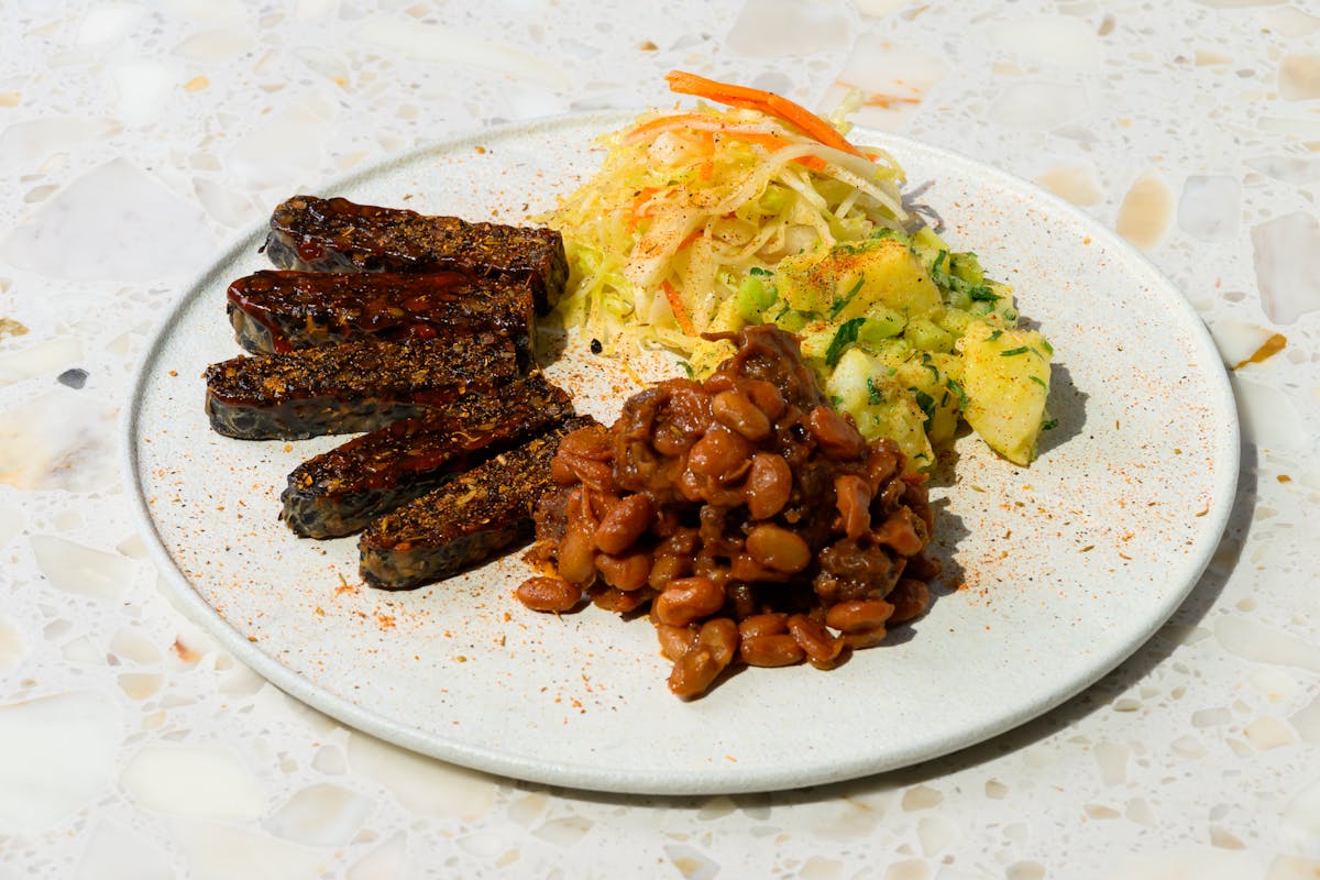 a plate of food with rice meat and broccoli