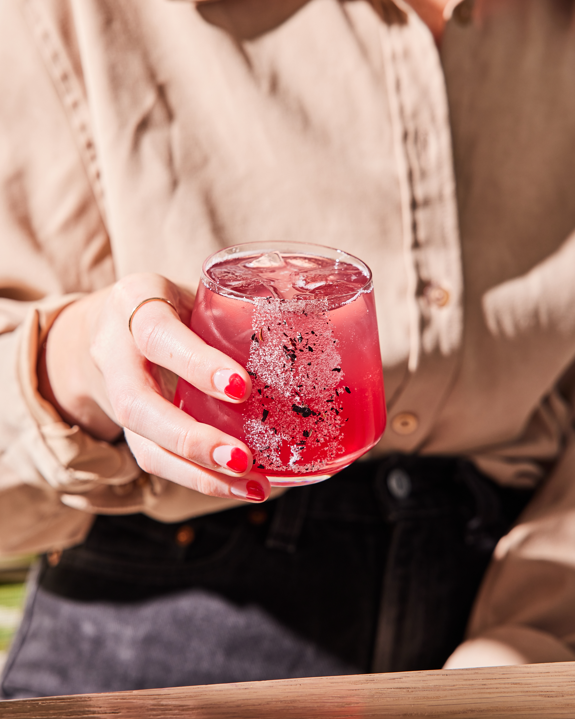 a hand holding a cocktail