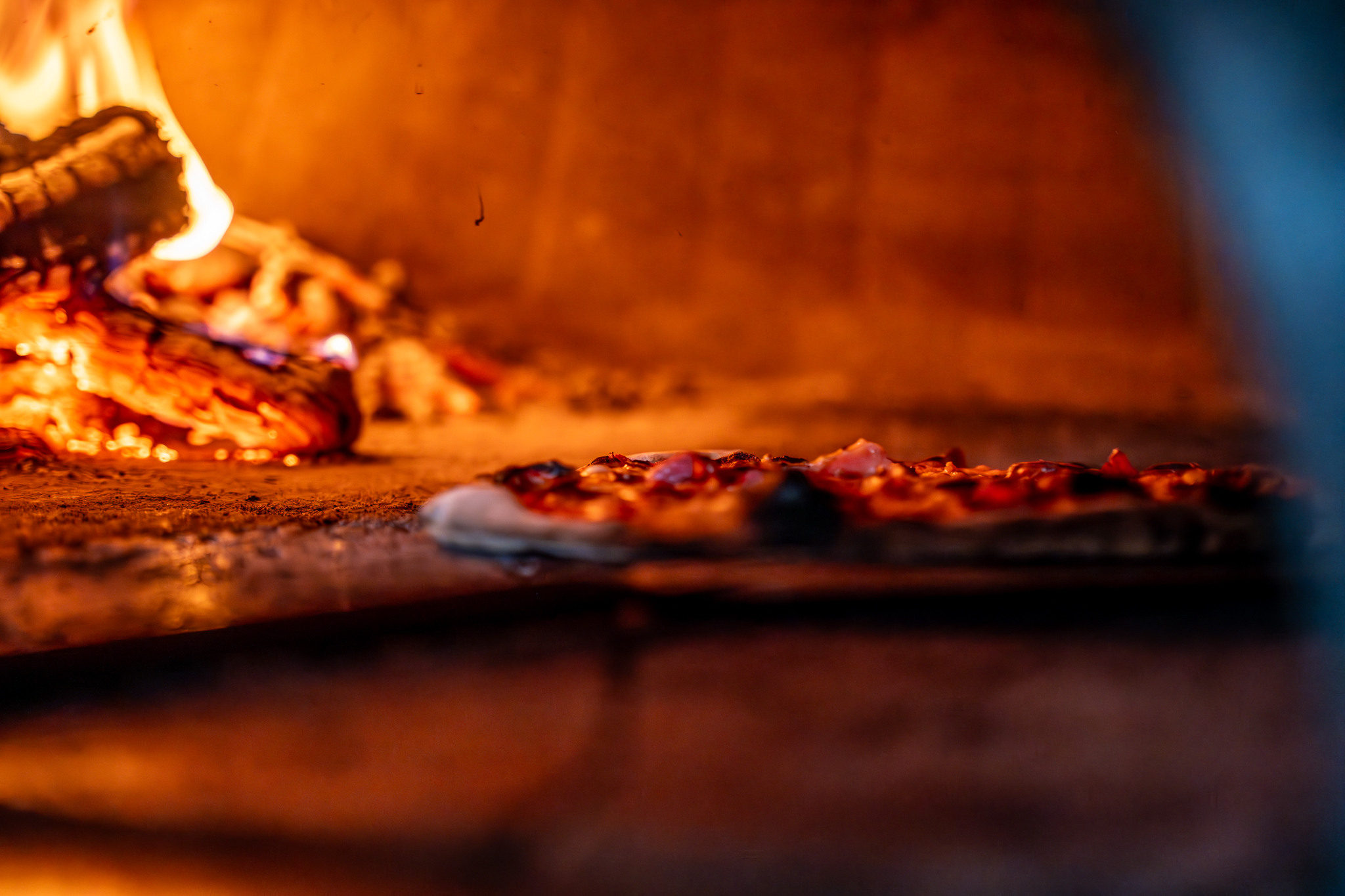 a close up of a pizza on a grill