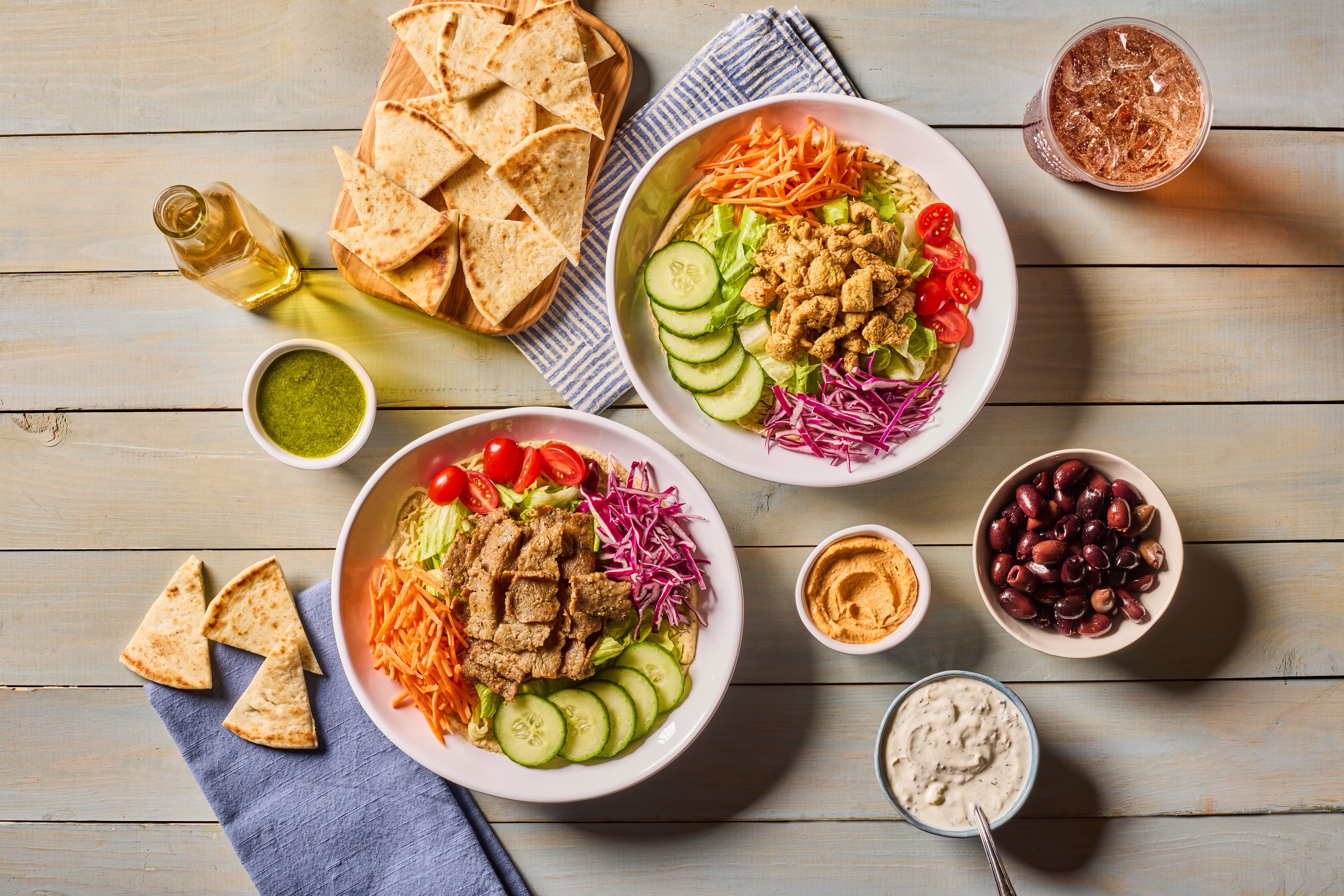 a bunch of food sitting on top of a wooden table