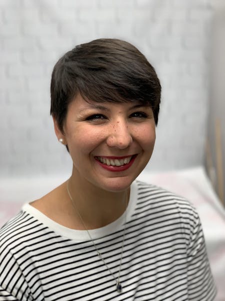 a woman smiling for the camera