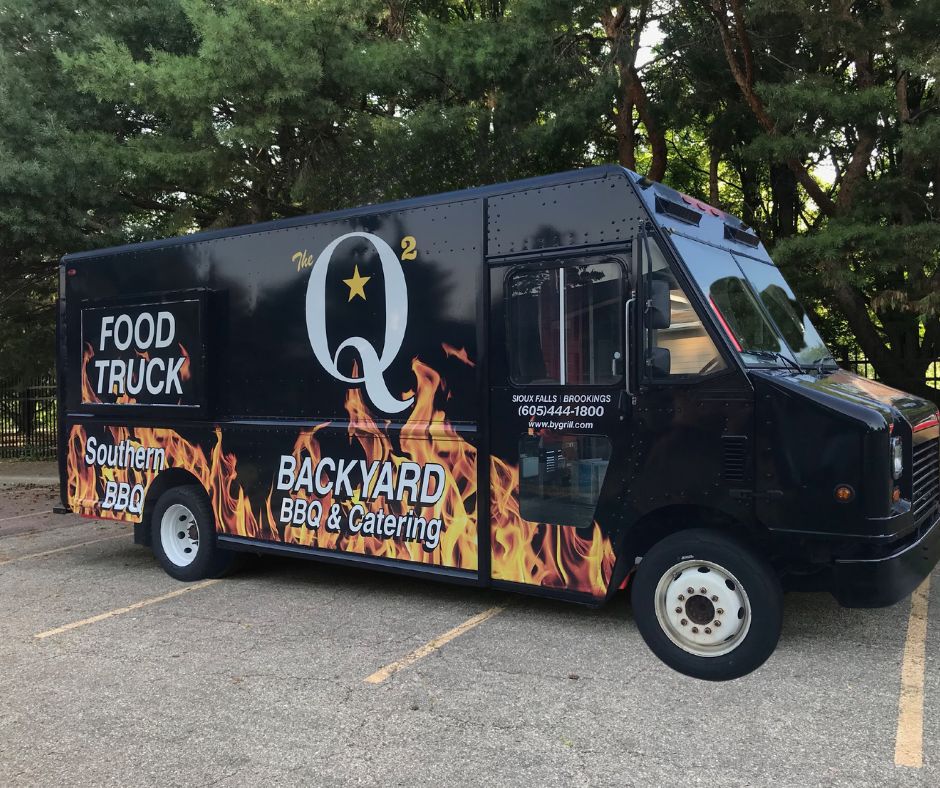 a truck parked on the side of a road