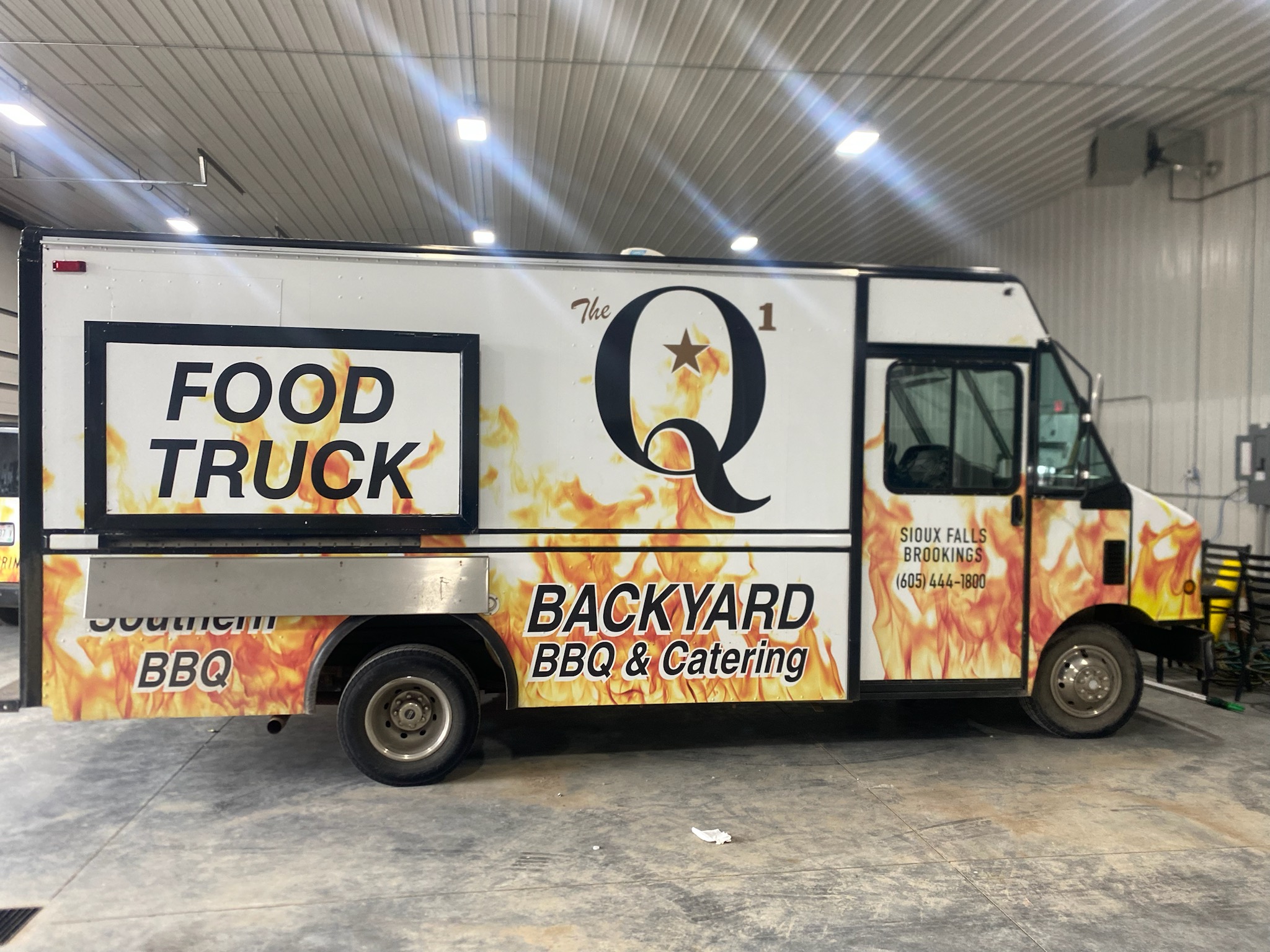 a box truck that is parked on the side of a road