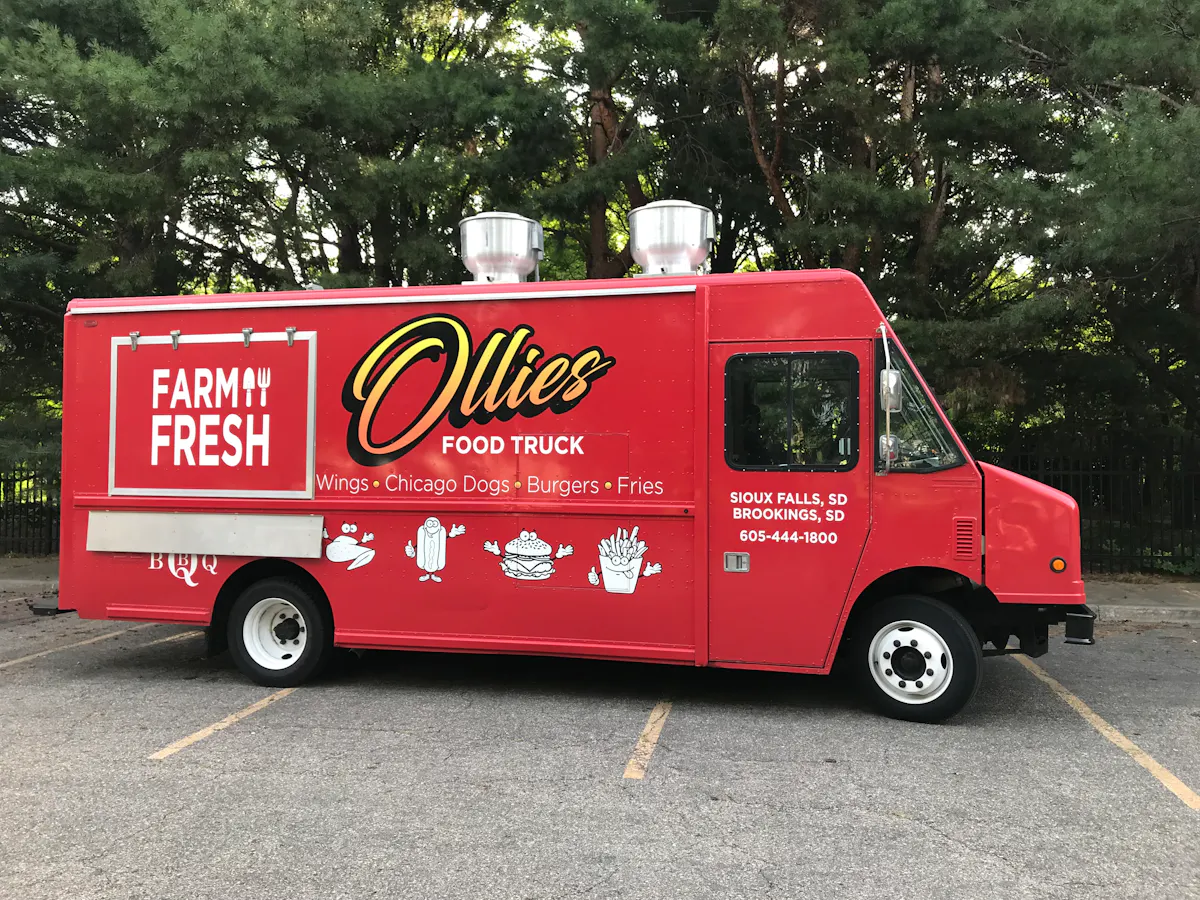 a red fire truck parked in a parking lot