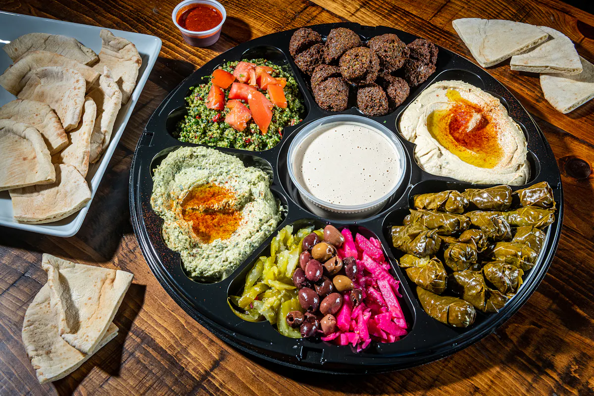 Mamoun's Vegetarian Platter with falafel, hummus, baba ganouj, tabbouleh, grape leaves, pickles and fresh pita