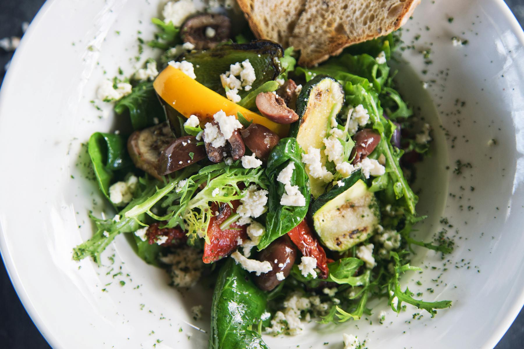 a white plate filled with a salad