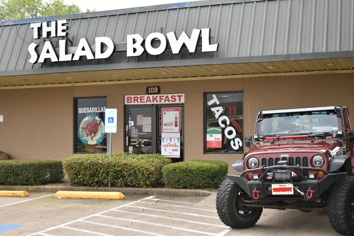 a truck is parked in front of a building