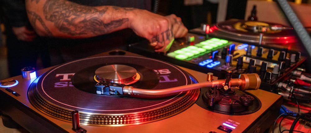 a dj with his vinyl decks at the Las Vegas bar, Bel-Aire Lounge