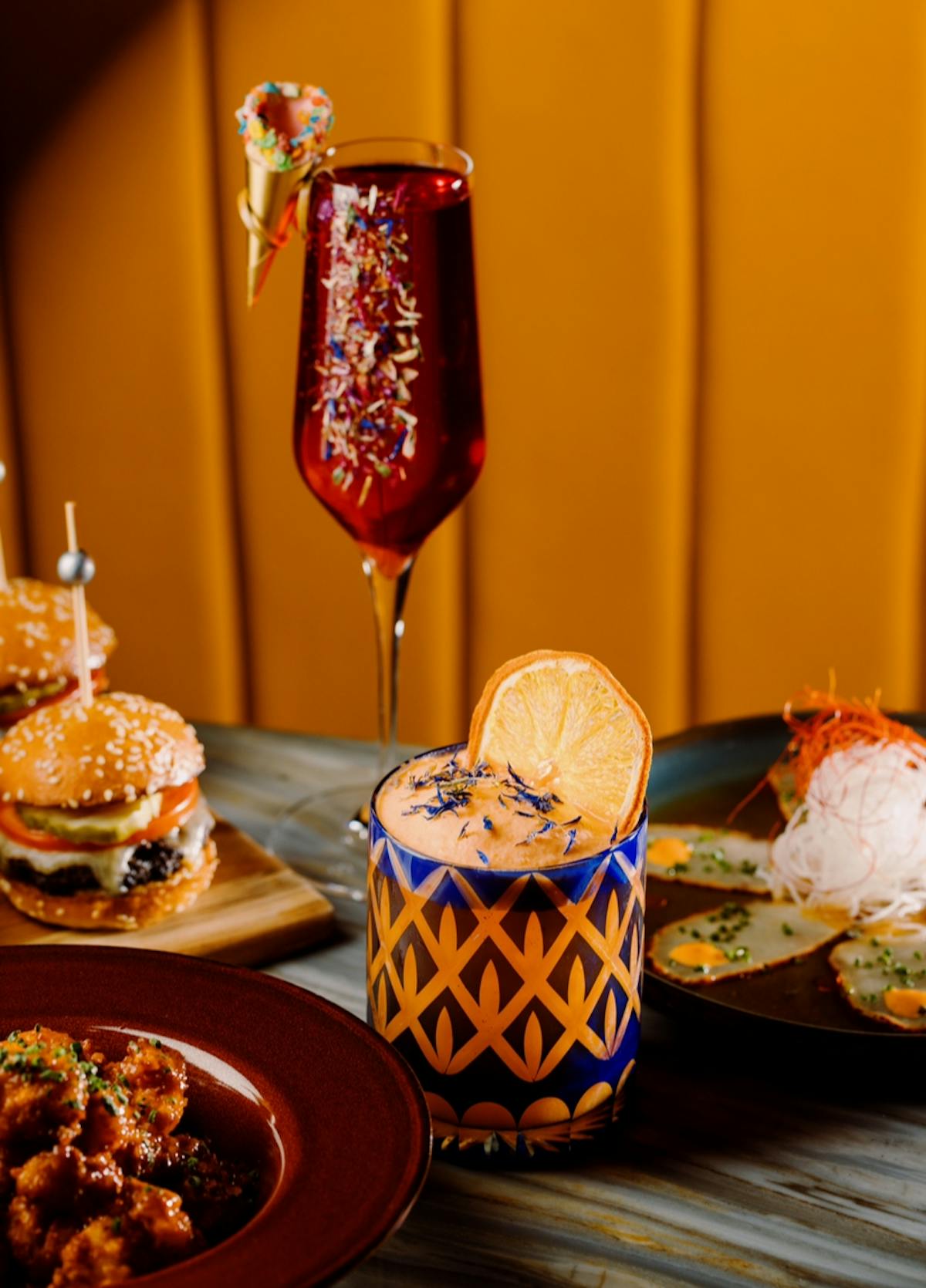 a spread of cocktails and small bites at Bel-Aire a Las Vegas Bar