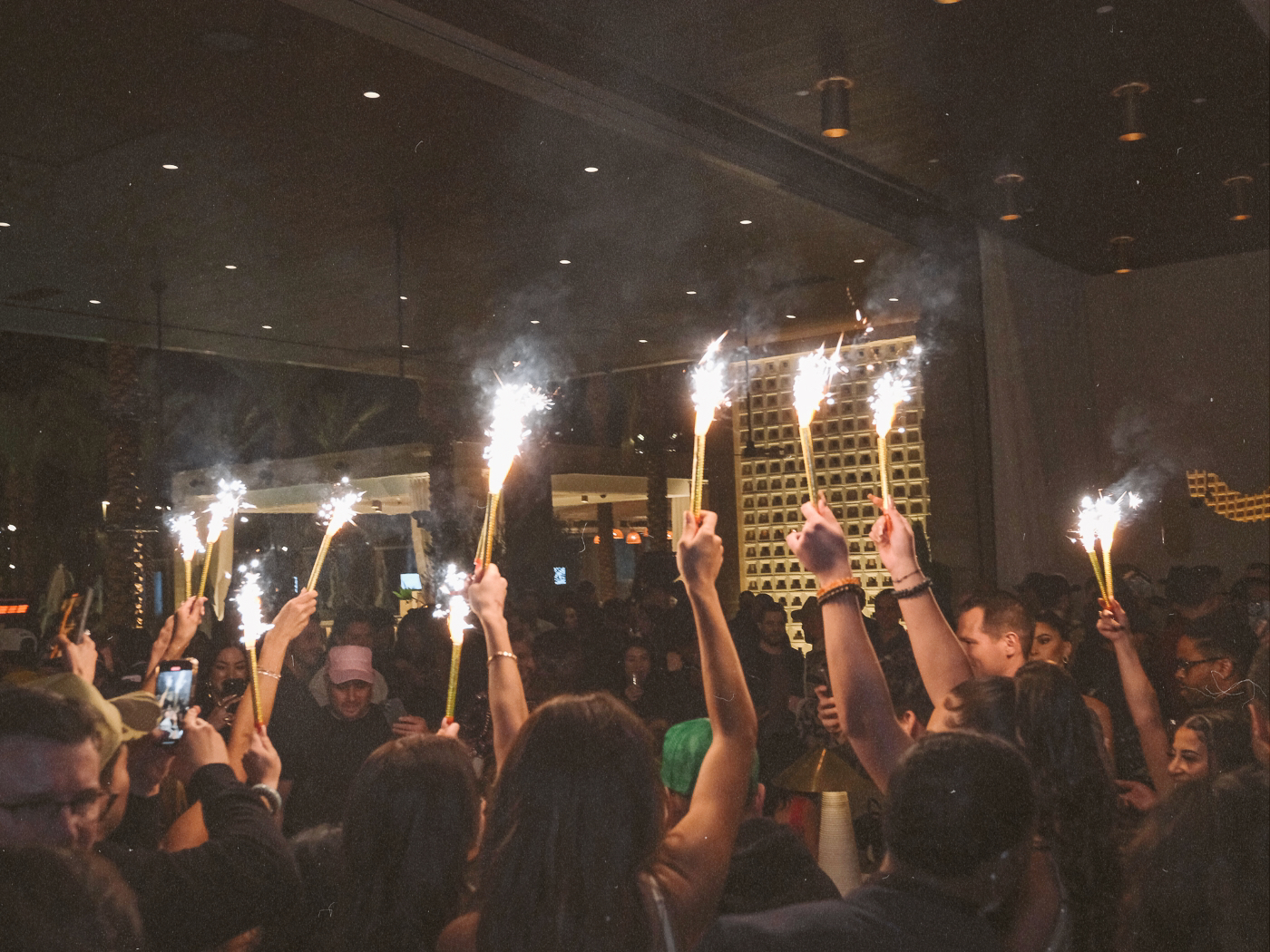 a bottle of alcohol coming out at Bel-Aire Lounge with a bunch of sparklers