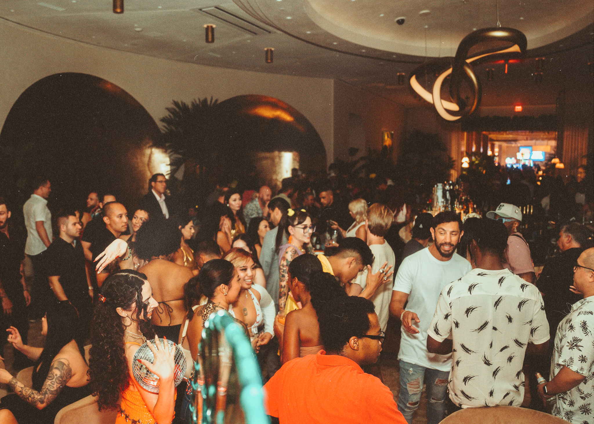 Packed crowd dancing and celebrating inside Bel-Aire Lounge at Durango Casino & Resort during a lively DJ night event.