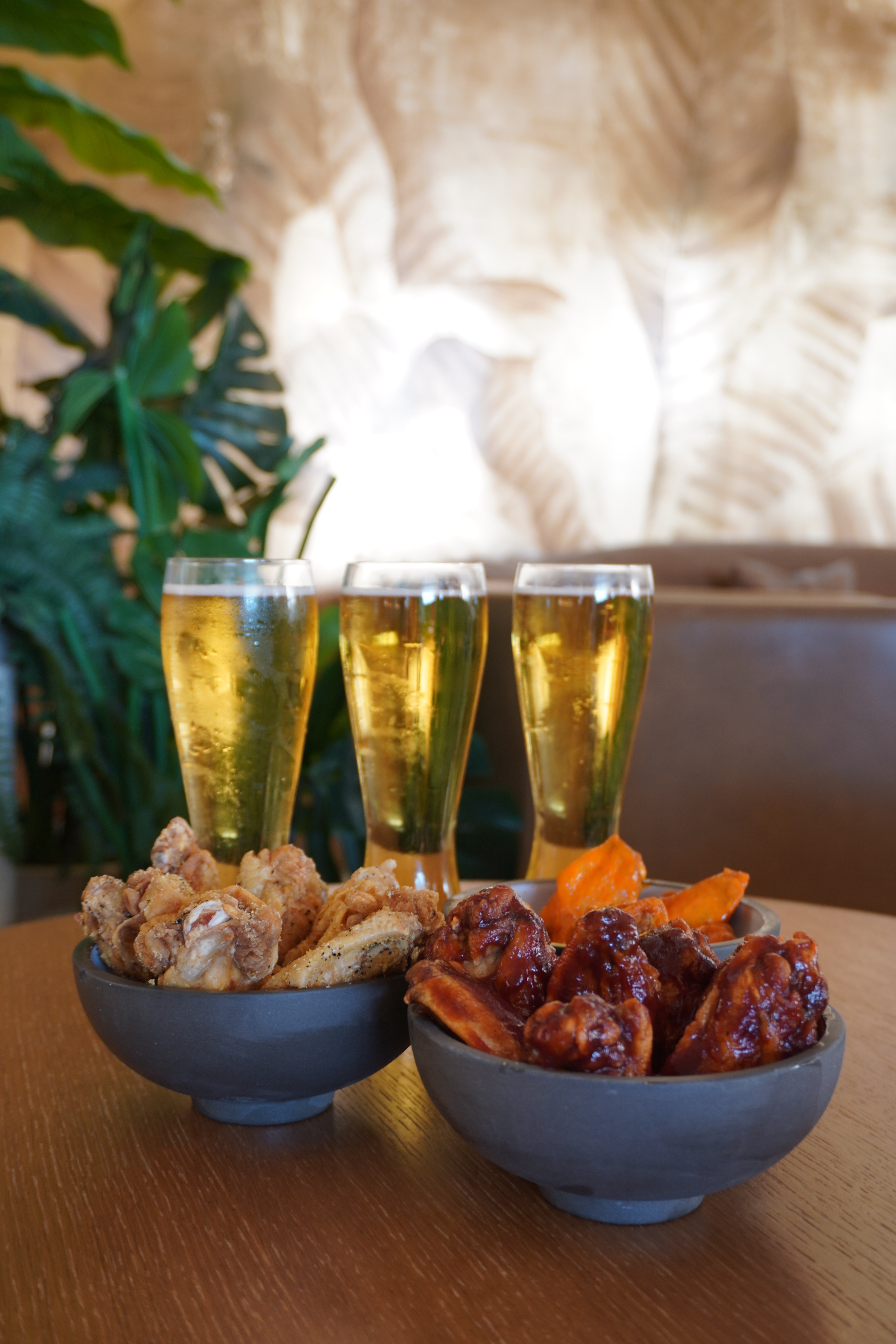 Bowls of chicken wings with four glasses of draft beer served at Bel-Aire Lounge during Monday Night Football specials in Las Vegas.