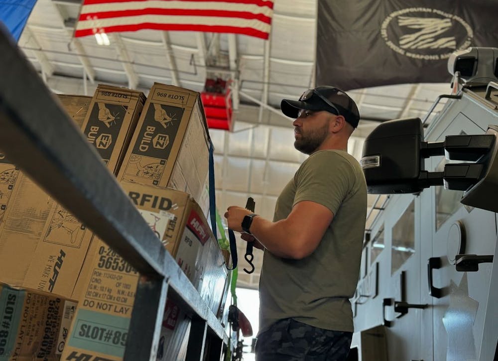 a photo of a Las Vegas swat team member loading up bikes for the superheros4sully bike drive