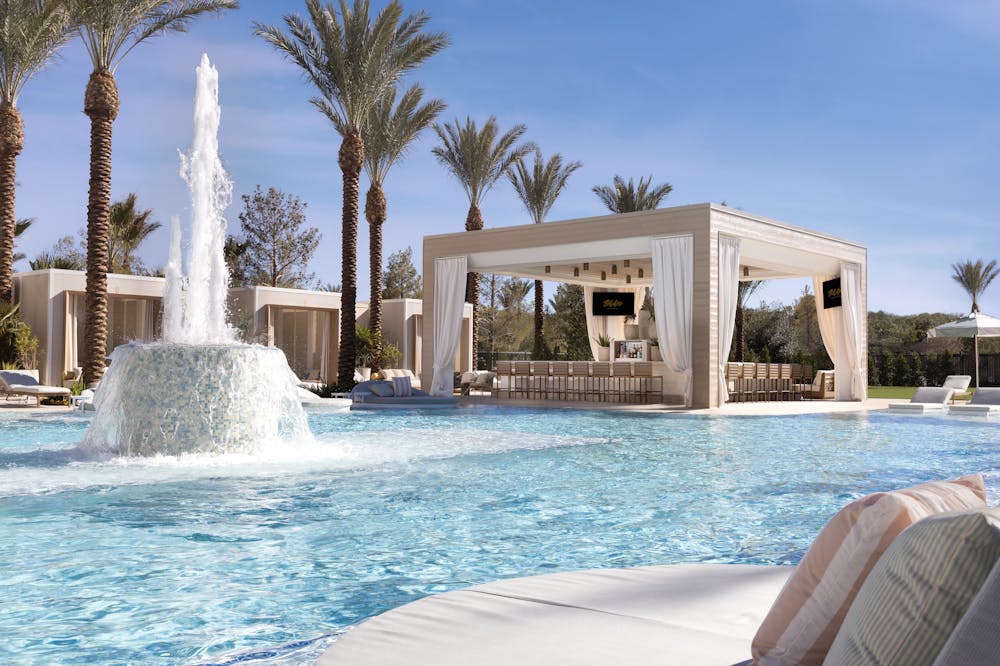 A shot of the pool and water fountain at the Las Vegas pool bar, Bel-Aire Backyard