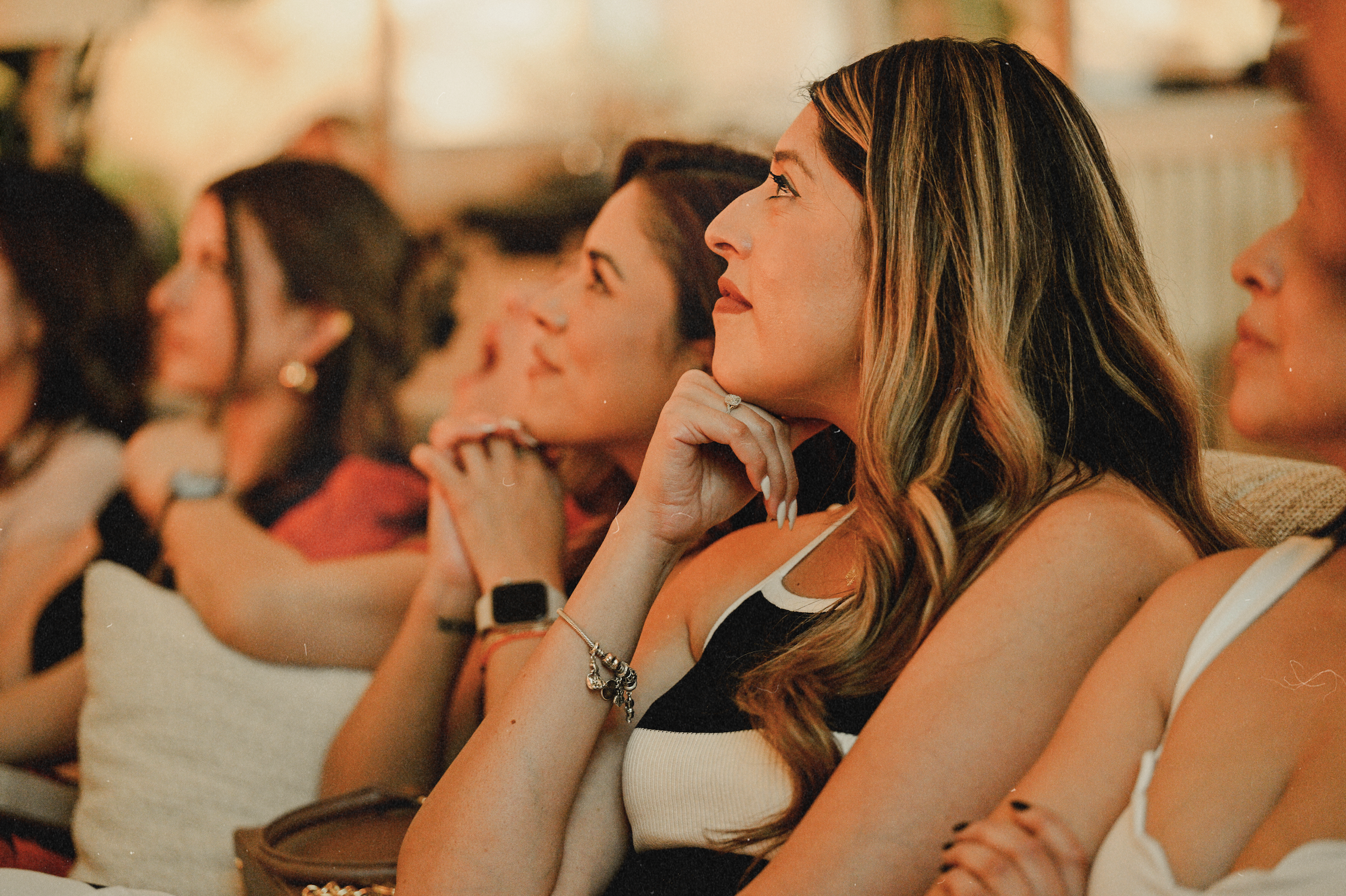 Guests watching The Hottest Dating Reality Show finale at Bel-Aire Lounge, a Las Vegas lounge with big screens, cocktails, and the ultimate watch party experience.