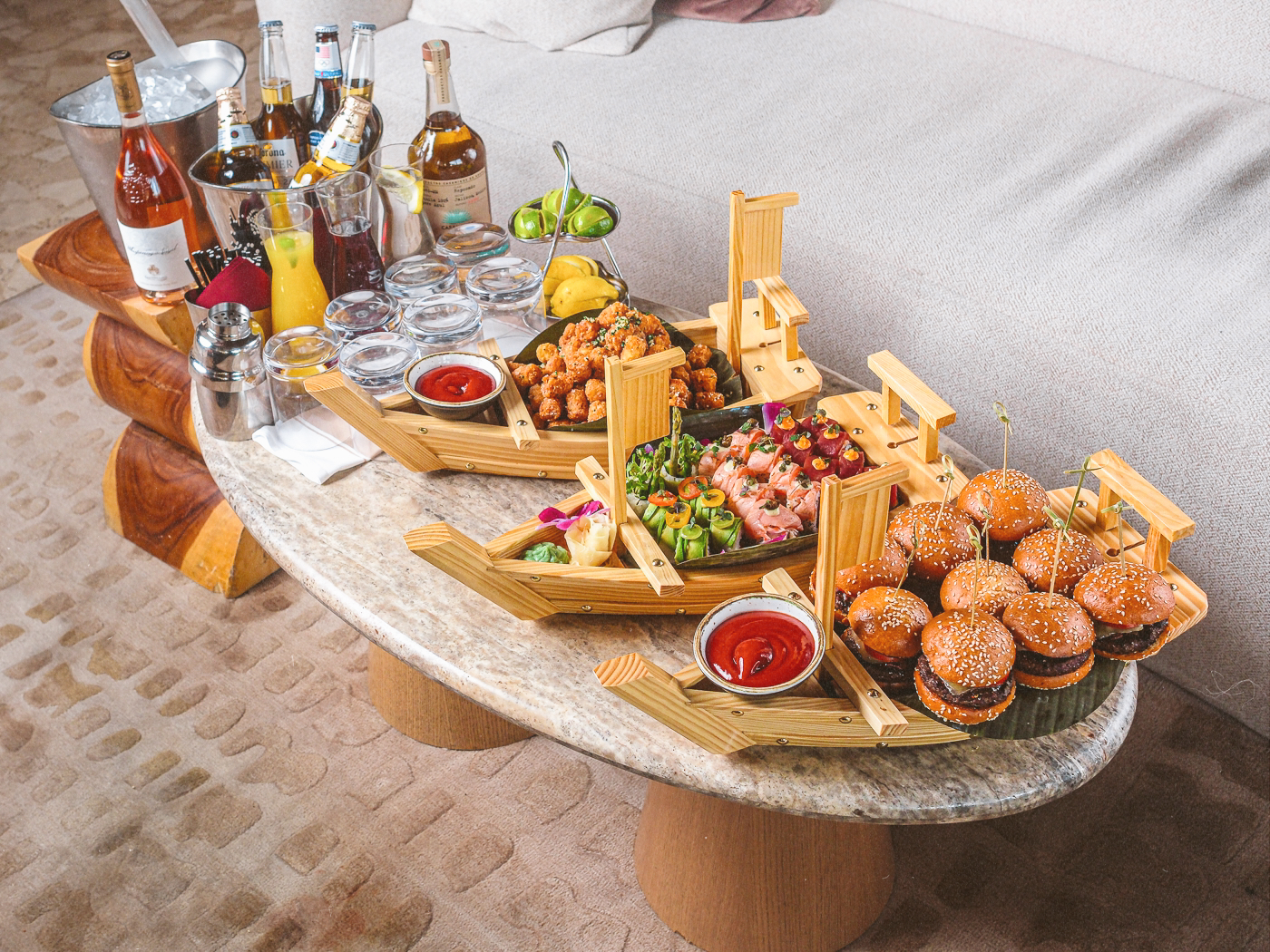 a photo of a tater tot, sushi, and slider platter at Bel-Aire Lounge that are sold only during football games