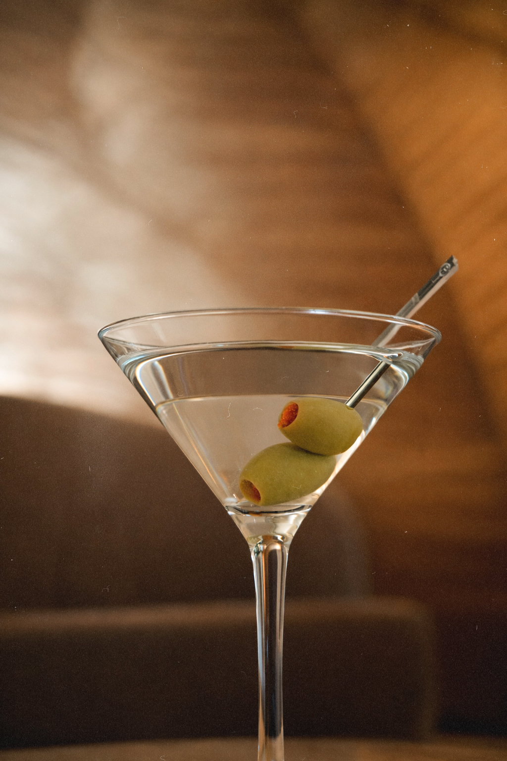 Classic dirty martini with olives served inside Bel-Aire Lounge, an upscale lounge near me destination inside Durango Casino & Resort in Las Vegas.
