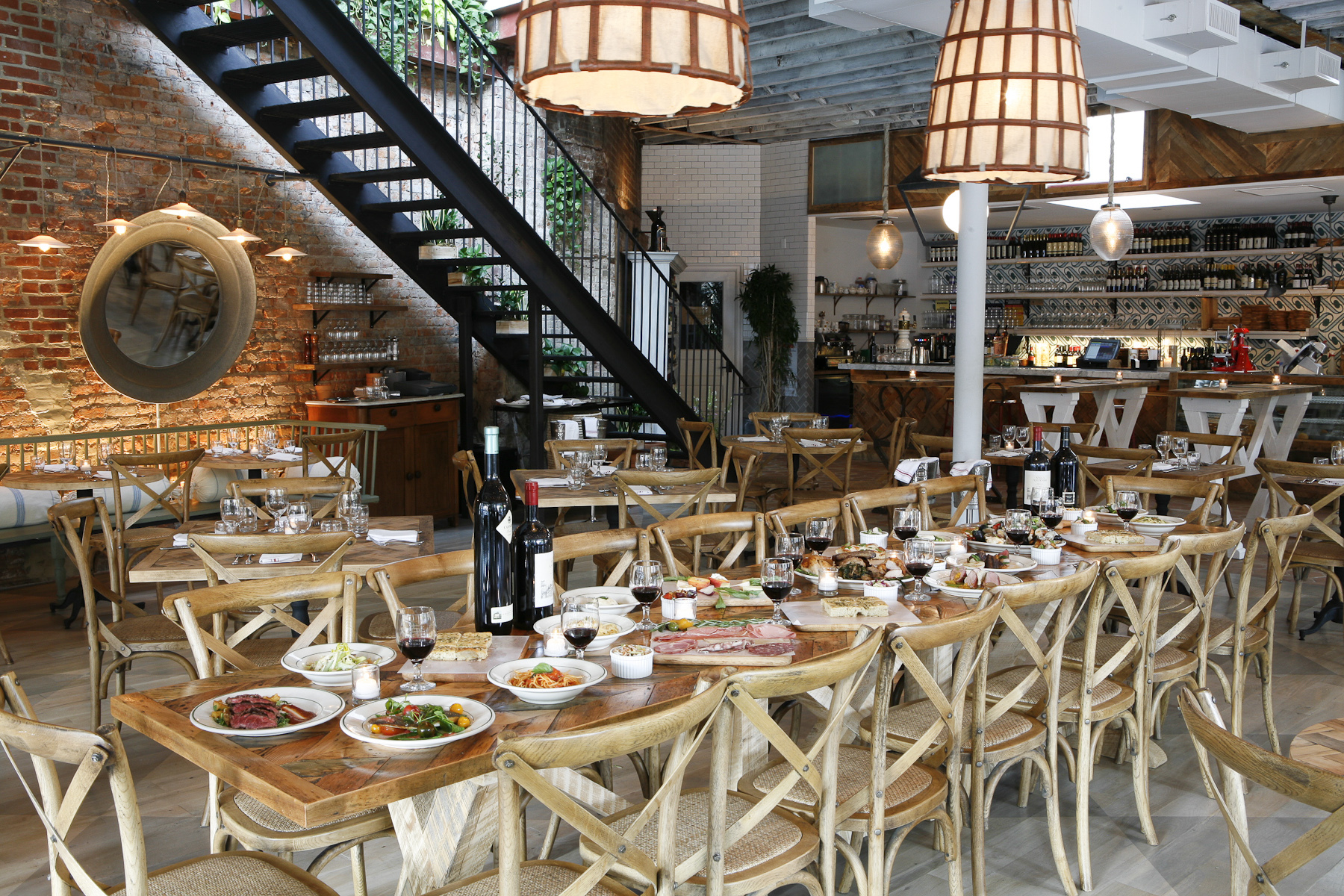a group of people sitting at a table in a restaurant