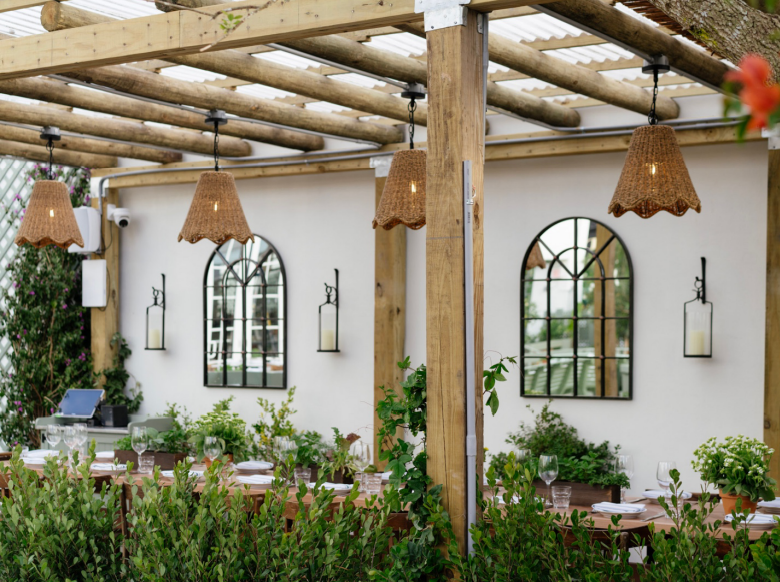 a vase of flowers sitting on top of a building