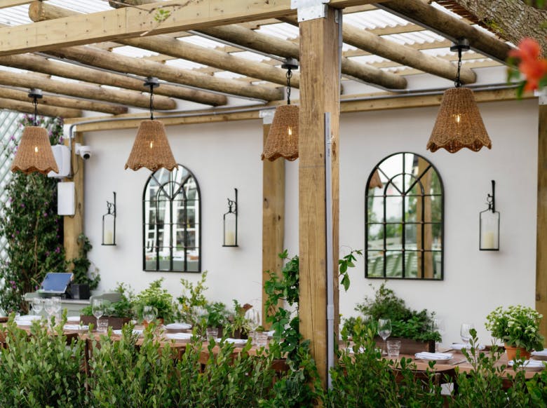a vase of flowers sitting on top of a building