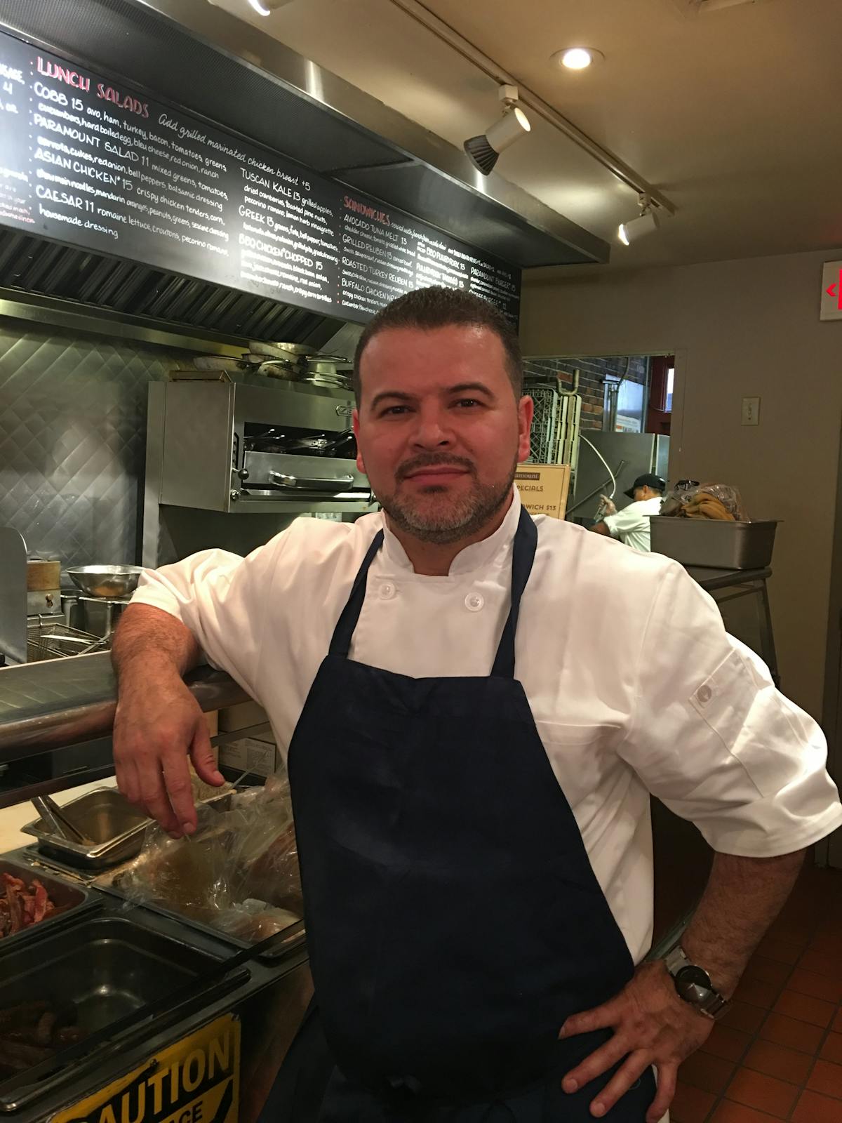 a man cooking in a kitchen