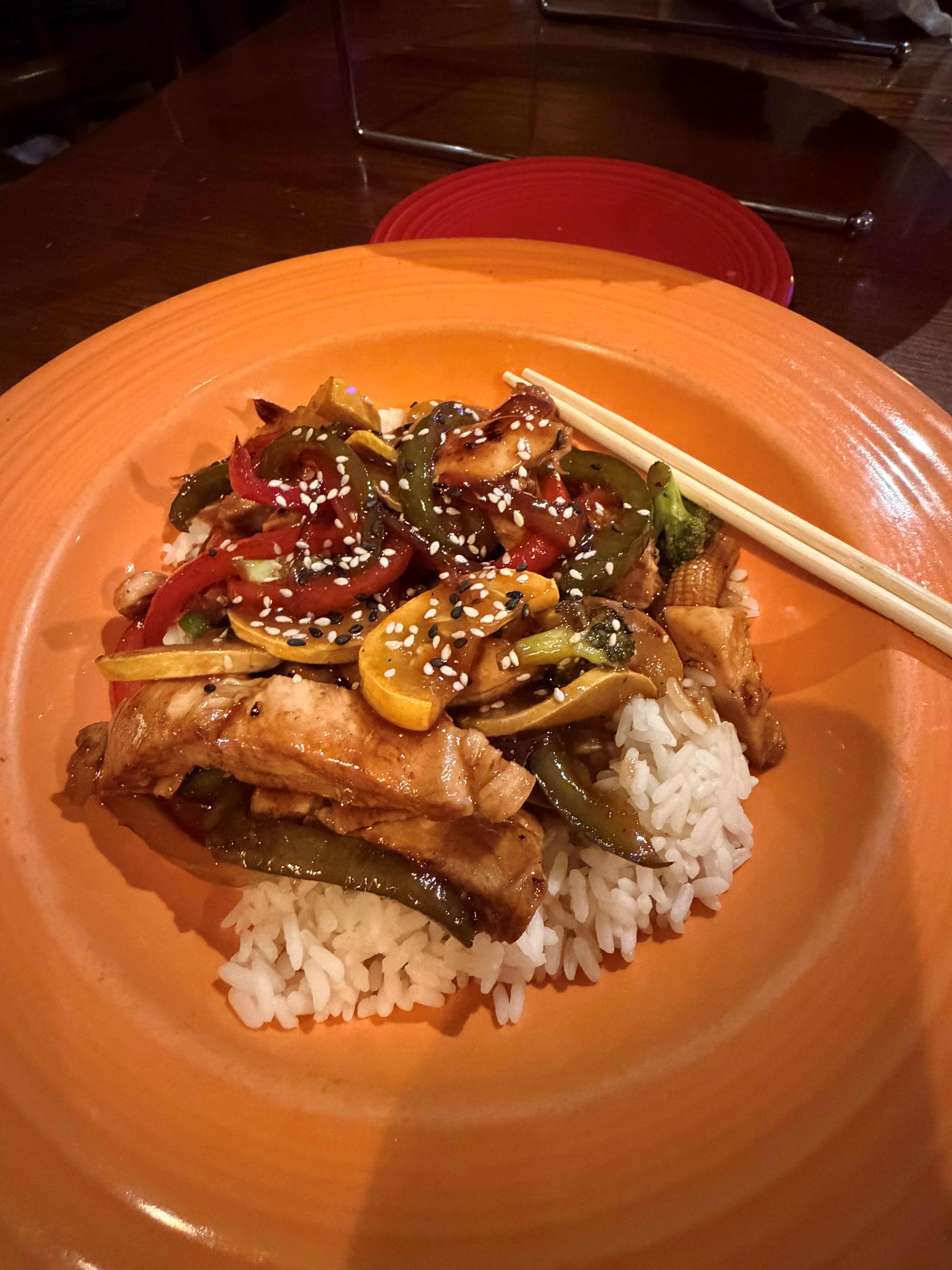 a plate of food with rice meat and vegetables