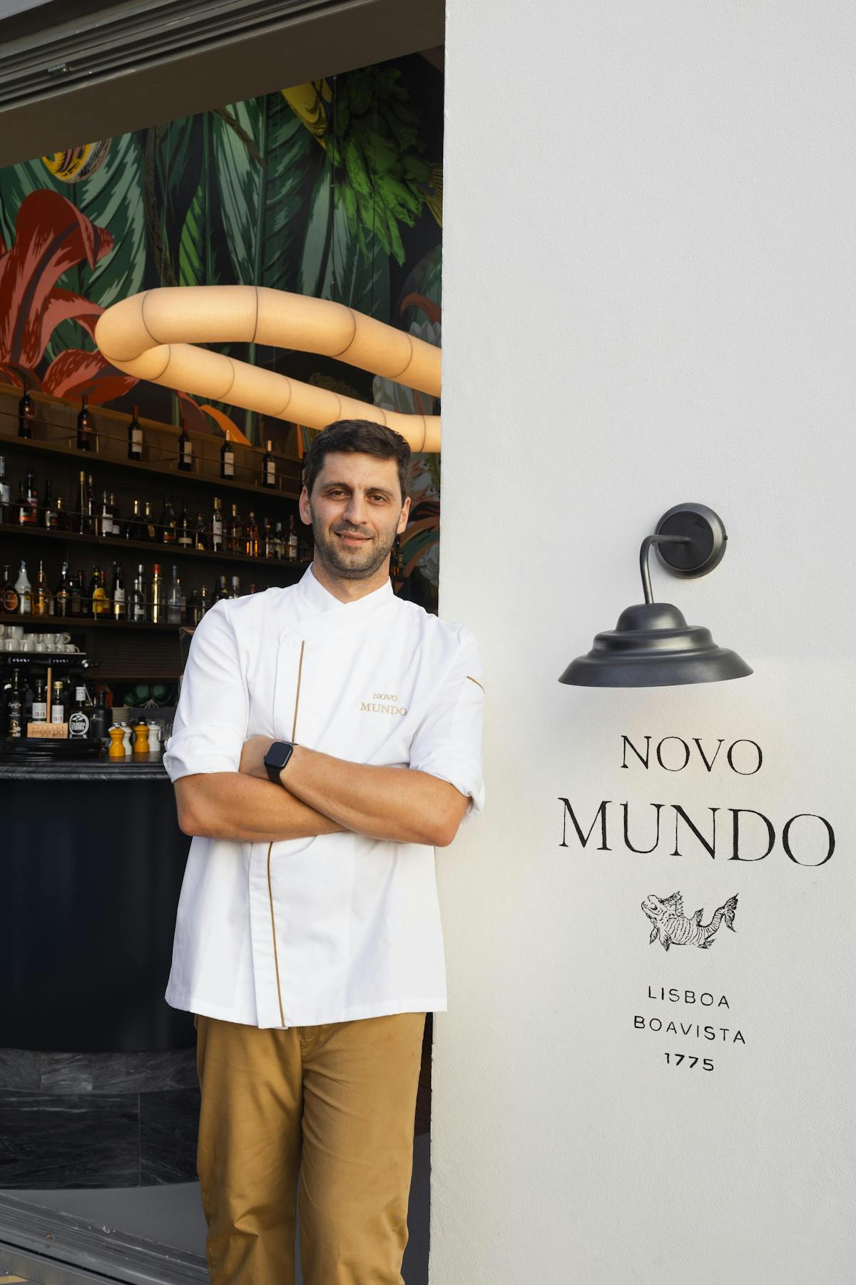 a man holding a sign posing for the camera