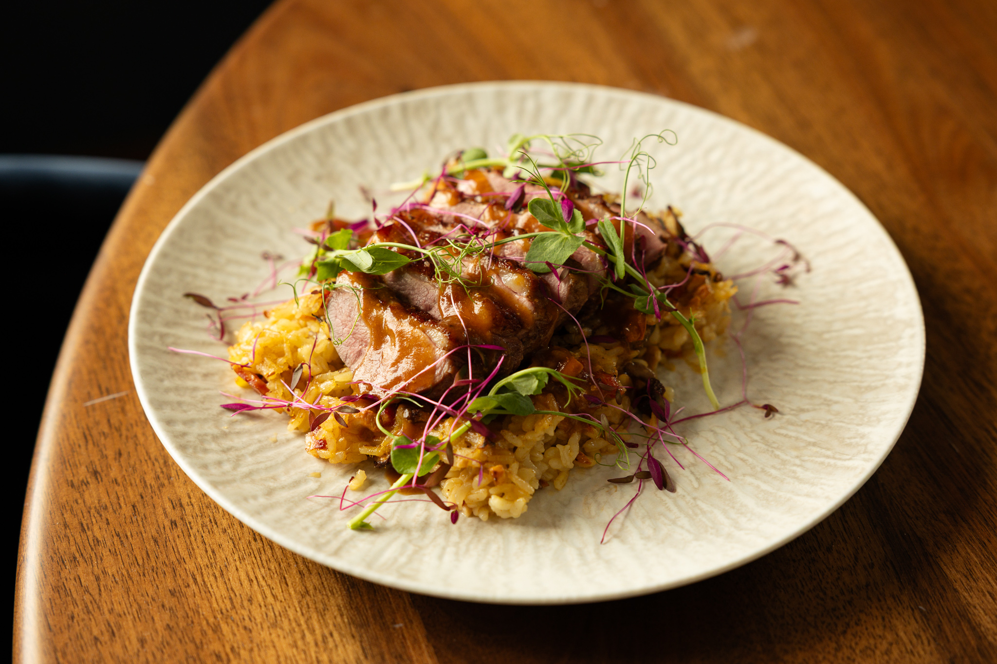 a plate of food on a wood table