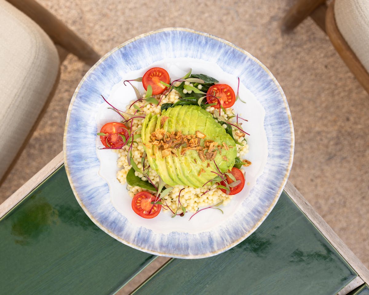 a bowl of food on a plate on a table