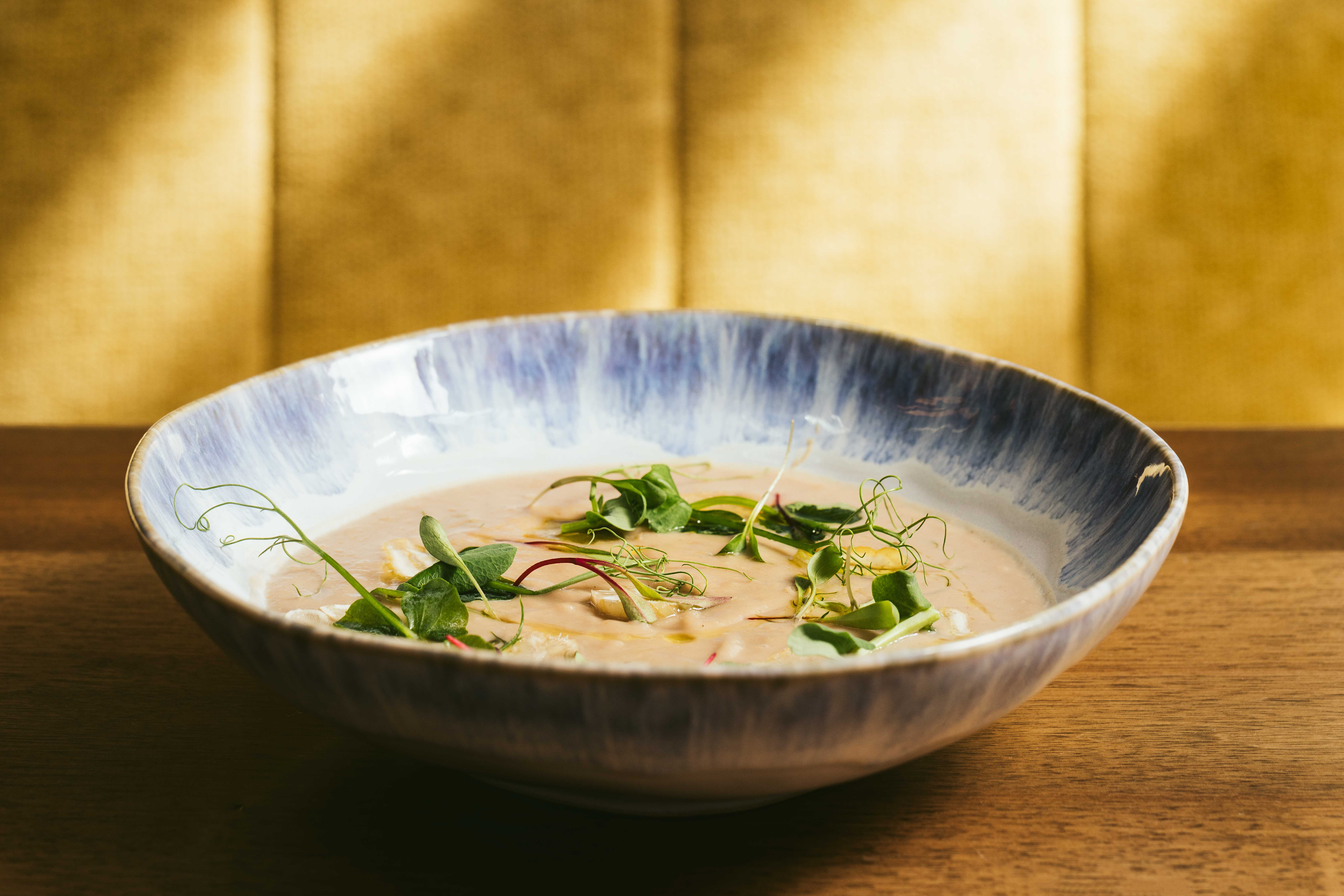 a bowl of food sitting on a table